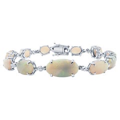 Bracelet en or 18 carats avec opales de forme ovale Lightning Ridge d'un poids total de 15,70 carats