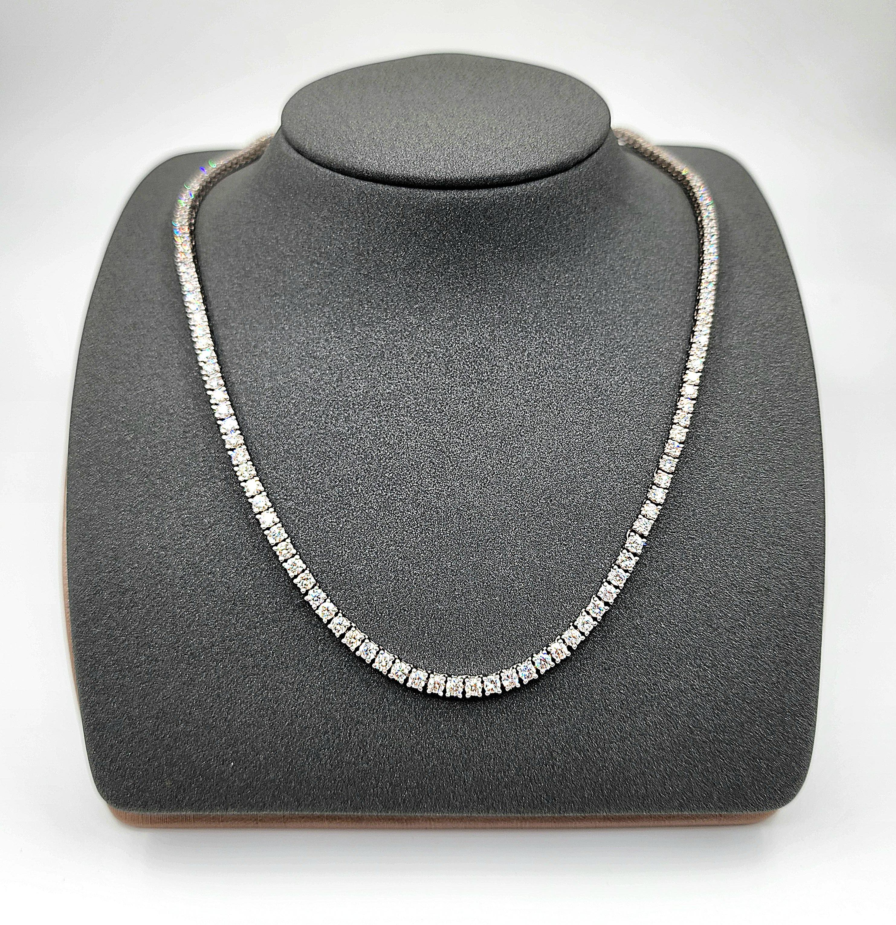 This beautiful 20 inch long diamond tennis necklace is sure to turn heads. 4 prong set in 14k white gold, the necklace has 165 diamonds which are G/H in color and VS2/SI1. A stunning piece to add to any wardrobe.