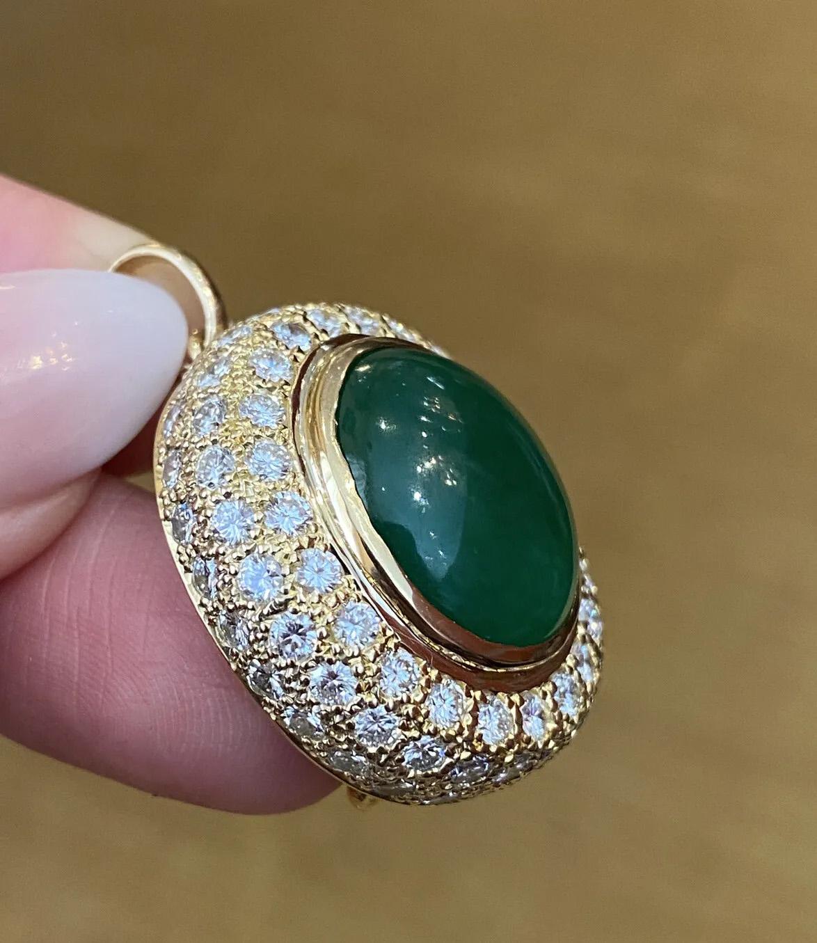 GIA Untreated Jadeite Jade Cabochon & Diamond Pendant in 18k Yellow Gold

Jadeite Jade & Diamond Pendant features a natural 15.71 Carat Oval Jade Cabochon surrounded by 4.10 Carats of Round Brilliant Diamonds Pavè set in 18k Yellow Gold.

The