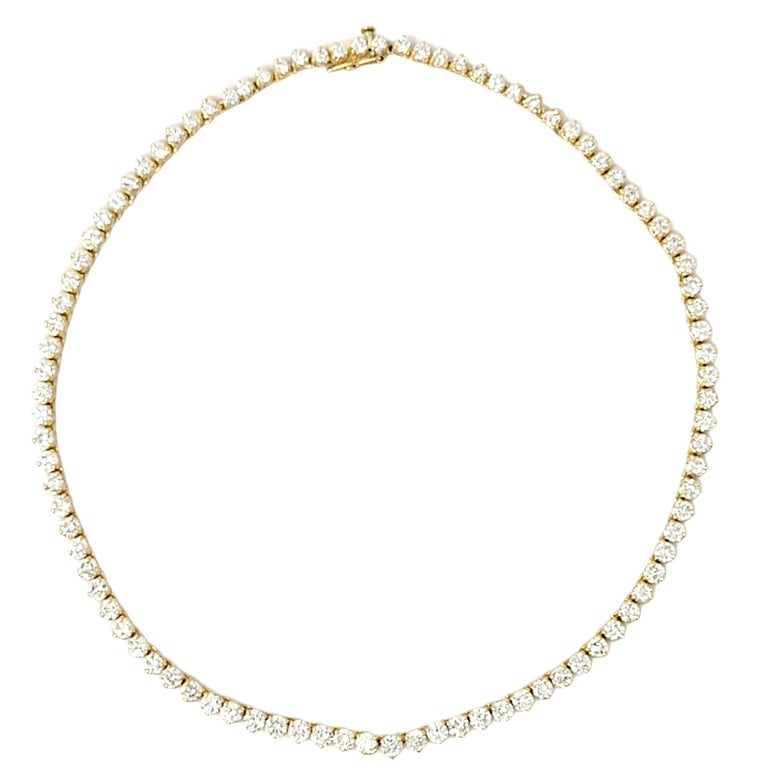 This is an absolutely breathtaking graduated diamond tennis necklace that will stand the test of time. The elegant yellow gold setting paired with the timeless round diamonds makes this piece a true classic that will never go out of style. This