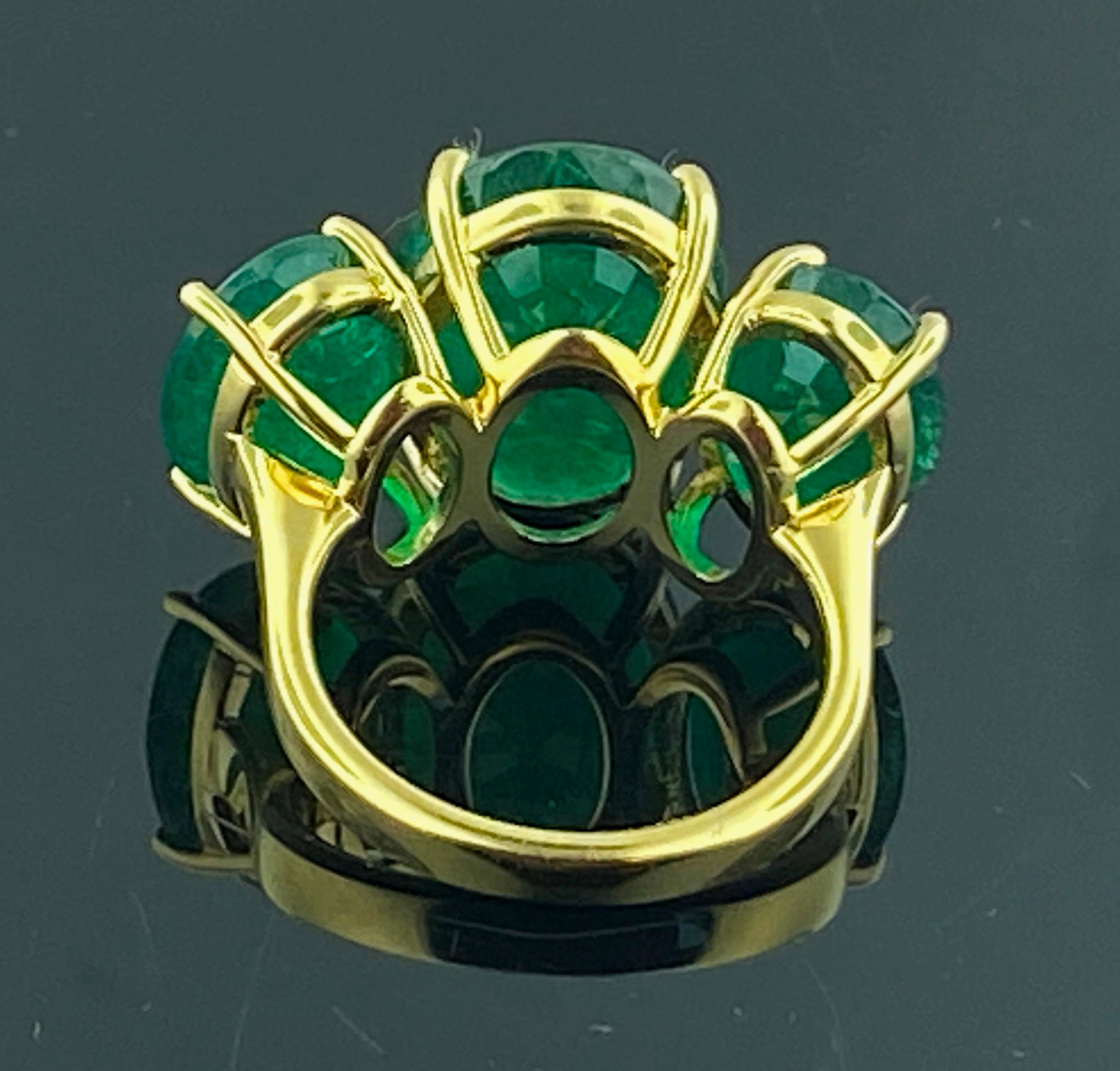 Set in 18 karat yellow gold, weighing 9 grams, are three Oval Cut Emeralds.  The center Emerald is 8.93 carats, the side Emeralds are 3.47 carats and 3.37 carats for a total Emerald weight of 15.77 carats total.  Ring size is 6.25.