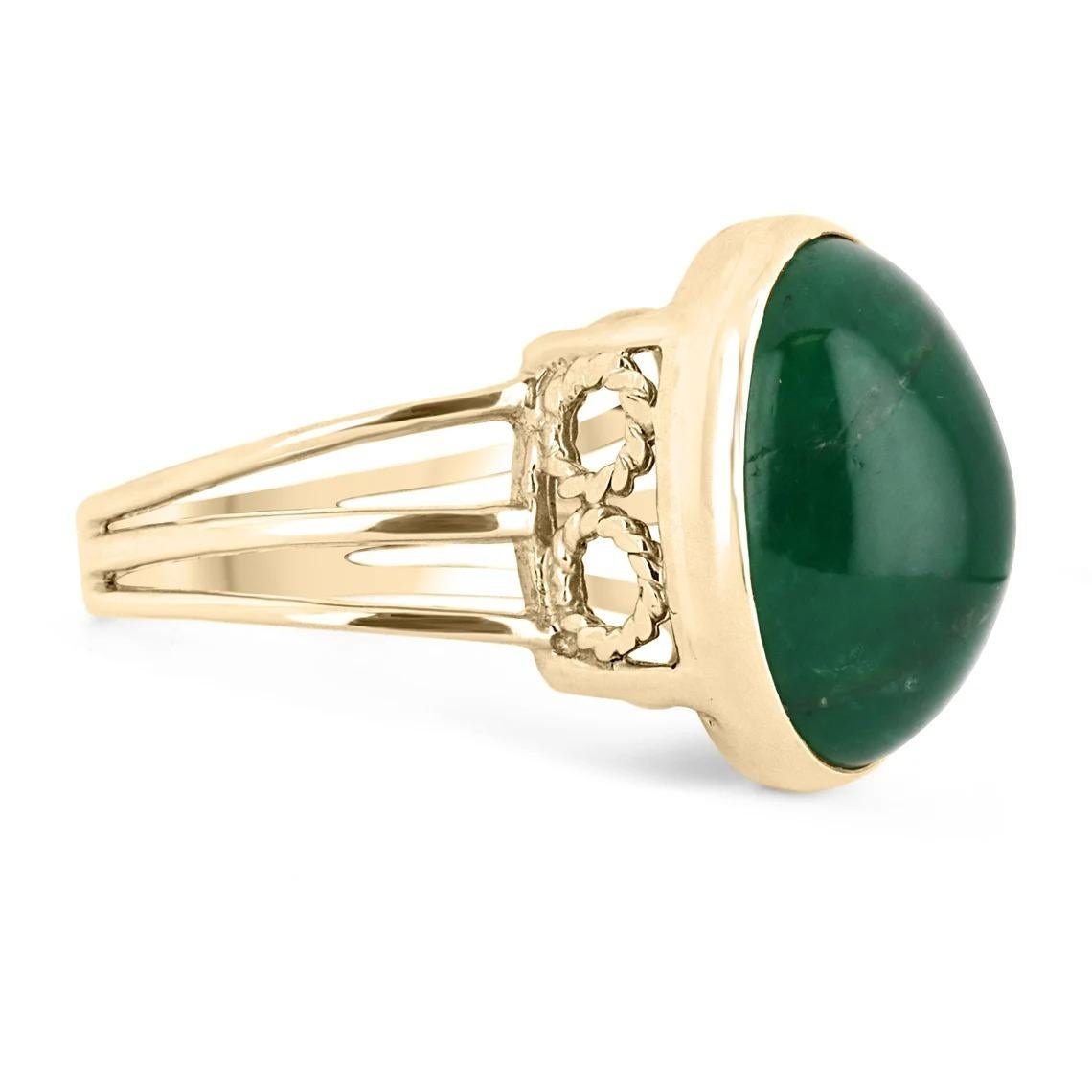 Displayed is a HUGE & RARE oval cabochon Colombian emerald solitaire ring in 14K yellow gold. This gorgeous solitaire ring carries a full 15.77-carat emerald in a secure bezel setting. The emerald is translucent and showcases a gorgeous deep forest