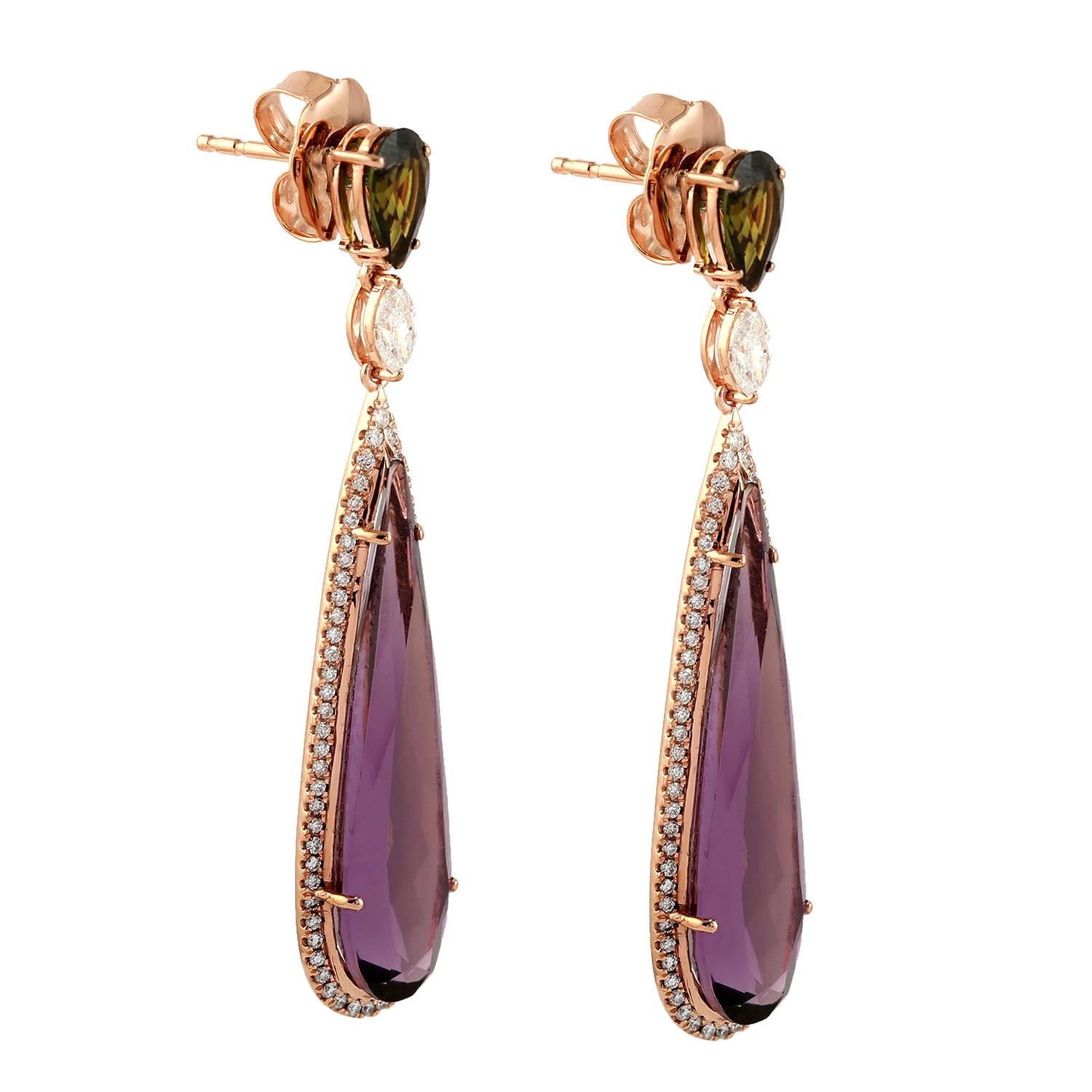 Hand cast from 14-karat gold, these stunning earrings are set with 15.78 carats amethyst. 1.45 carats tourmaline and 1.0 carats of sparkling diamonds.

FOLLOW  MEGHNA JEWELS storefront to view the latest collection & exclusive pieces.  Meghna Jewels