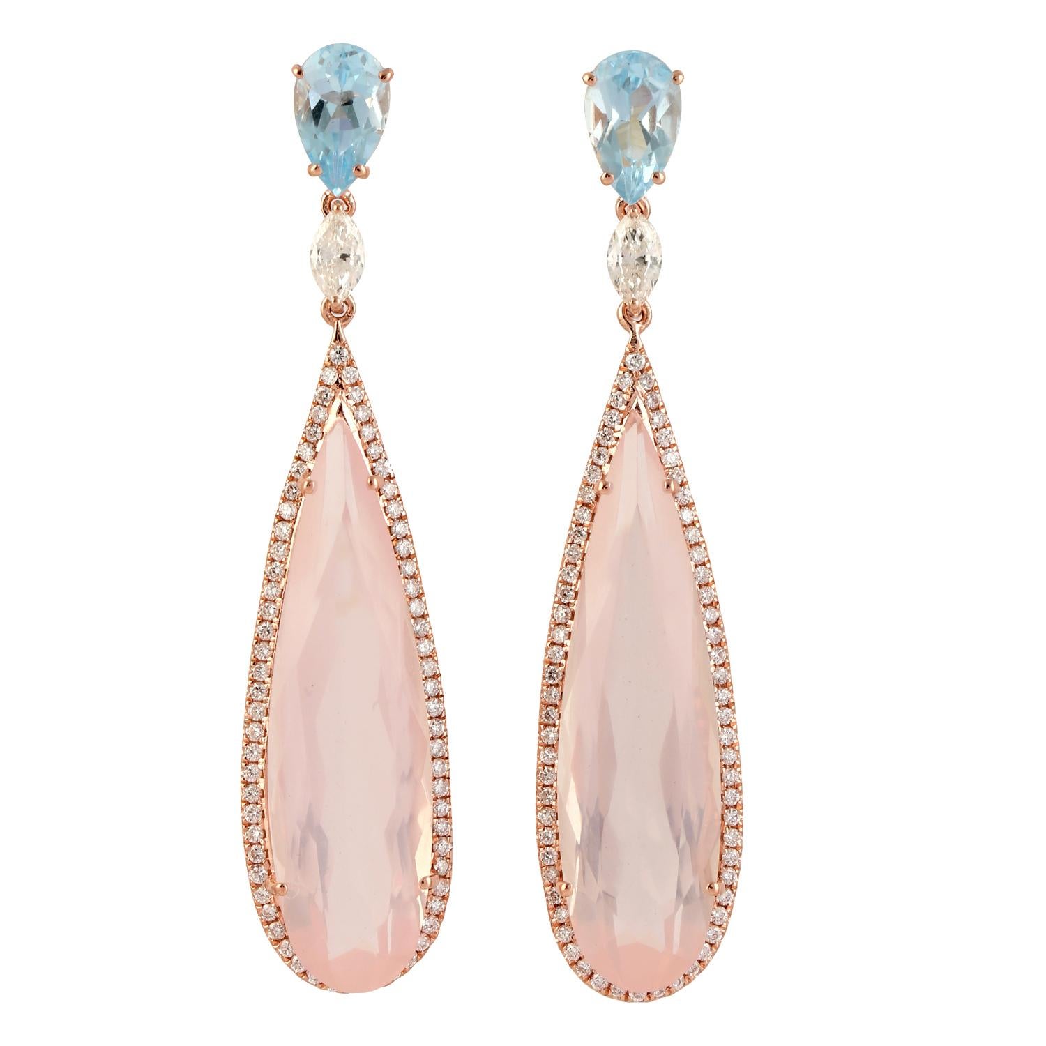 These beautiful earrings are cast in 14-karat gold. It is handset in 15.79 carats rose quartz, 2.26 carats topaz and illuminated with .90 carats of glittering diamonds. 

The ring is a size 7 and may be resized to larger or smaller upon request.