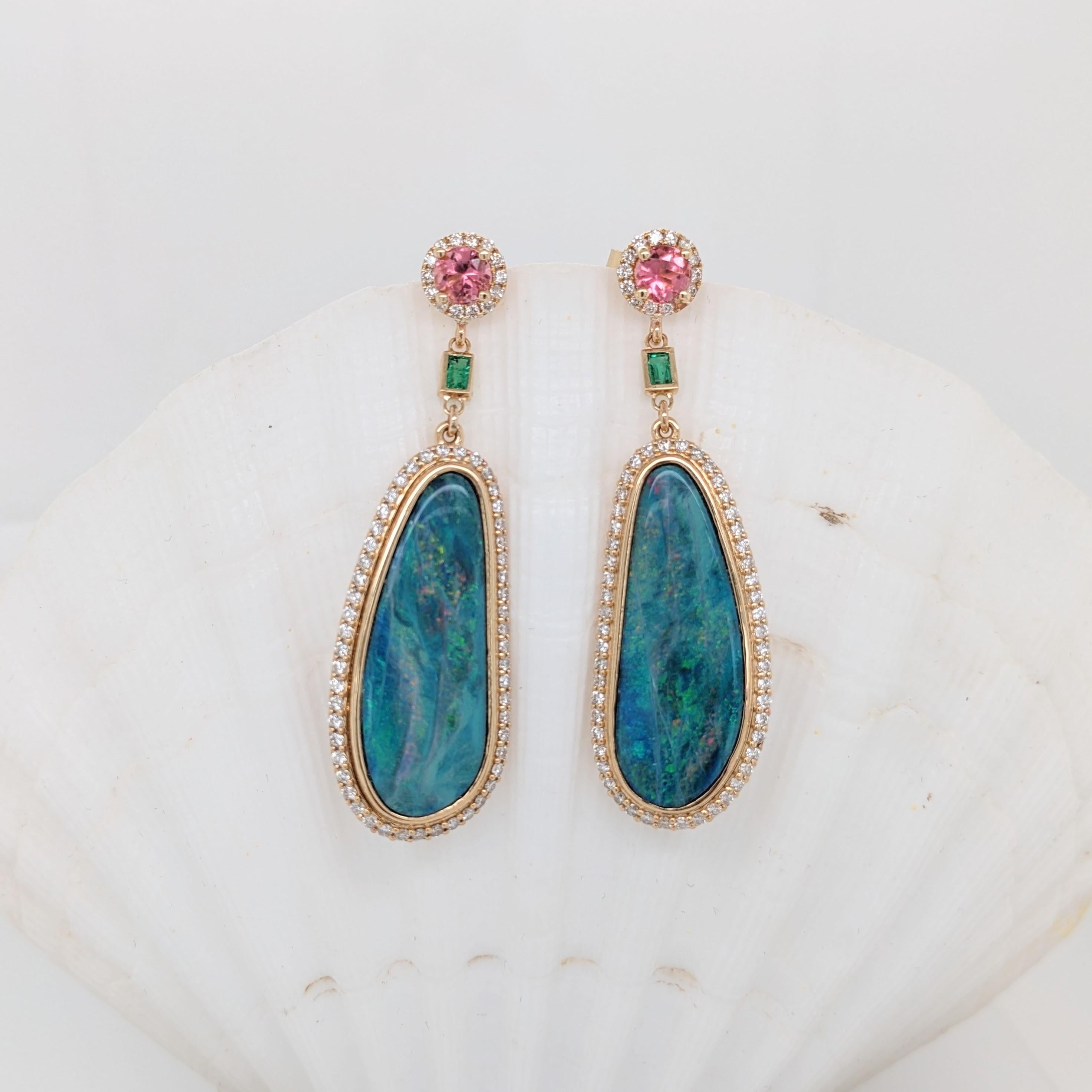 An absolutely stunning pair of earrings featuring gorgeous Boulder Opals bezel set in 14k solid yellow gold with a beautiful pink tourmaline and emerald accents. Colorful, elegant, classy and a definite conversation starter!

Item Type: