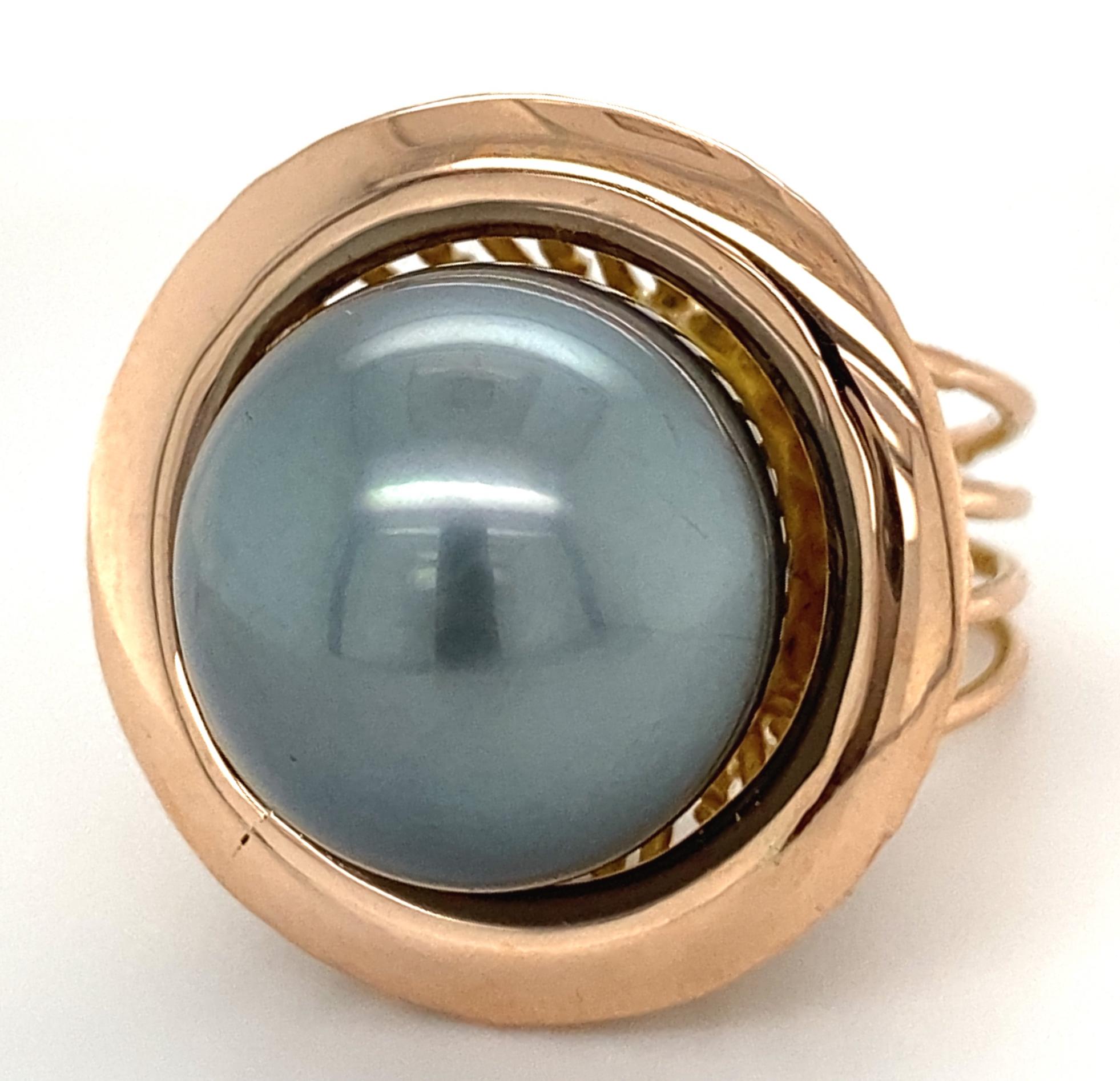 This ring, probably made in the 1960's or earlier, came to us set with a big blue topaz and an 18 karat yellow gold overlay.  Eytan Brandes polished off all the yellow (tiresome!) except on the inside, where time and abrasion will do the job.  Then