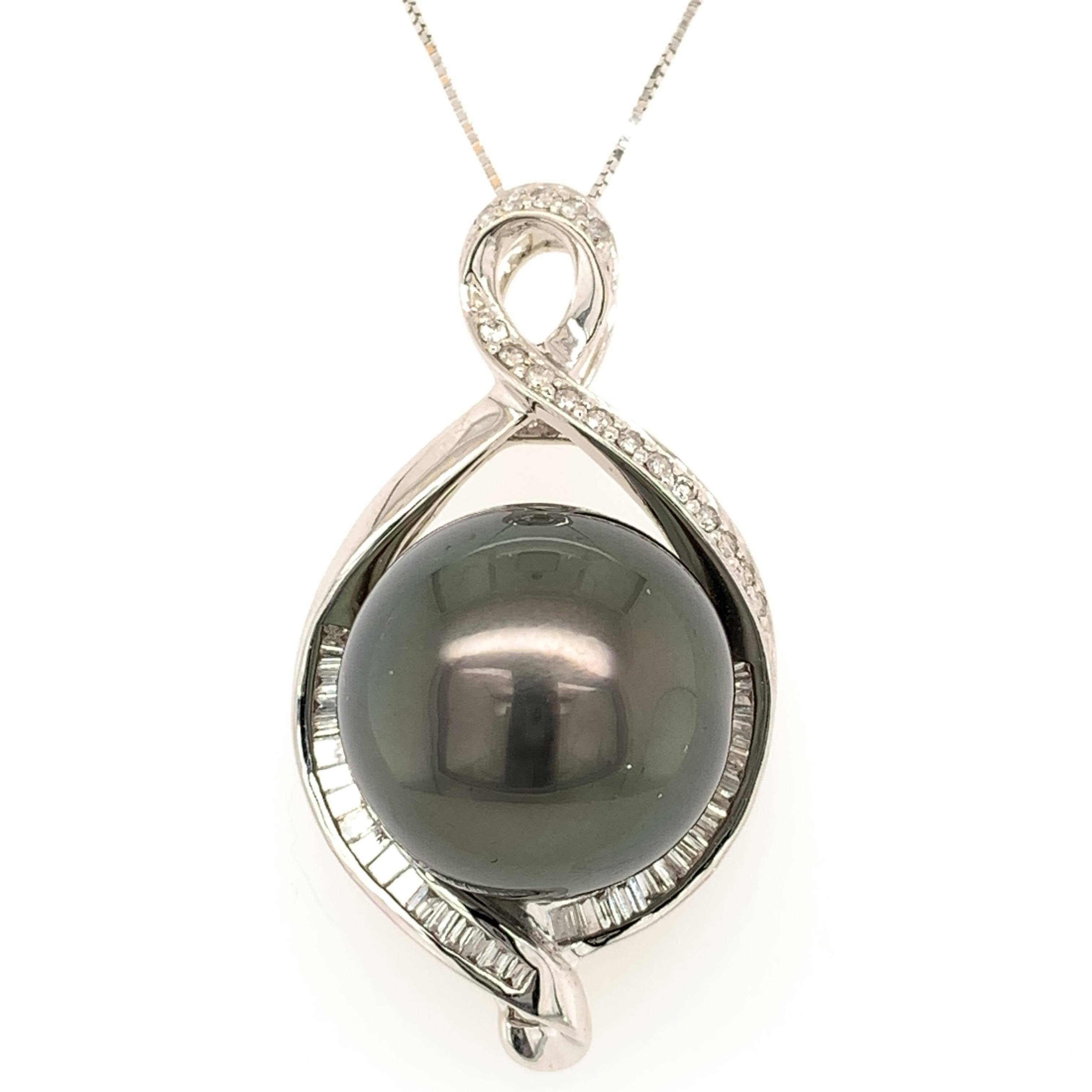 Stunning large Tahitian pearl pendant.  Very good luster, round 15.7mm Tahitian pearl, black with rose' and green overtone, accented with baguette cut and round brilliant cut diamonds. Handcrafted design set in 18 karats white gold, along with 10