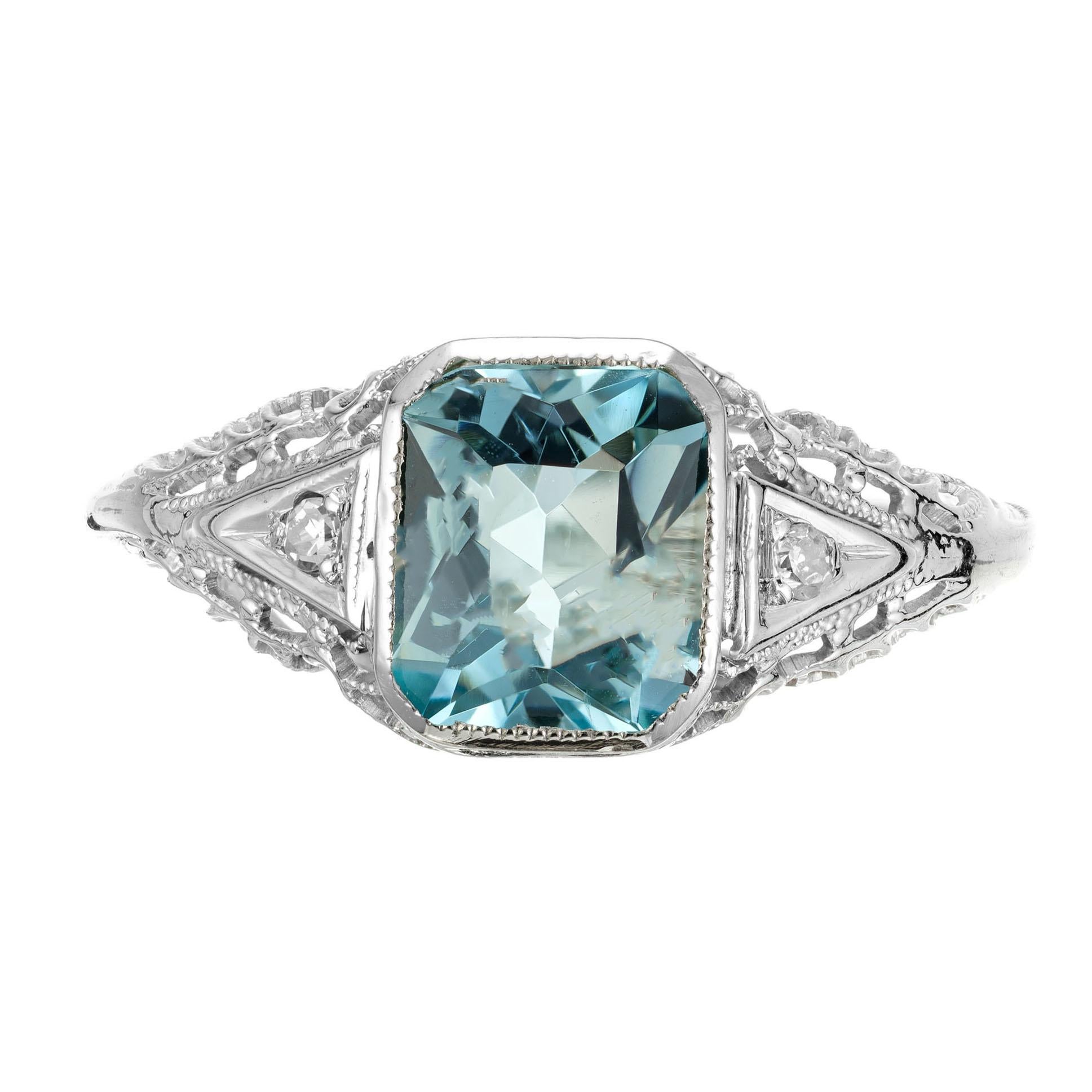 Aquamarine and diamond Art Deco filigree engagement ring. Natural no heat aqua center stone, set in a 14k white gold setting with 2 single cut accent diamonds. Circa 1930's.

1 Natural no heat untreated Aqua, approx. total weight 1.58cts, 8 x