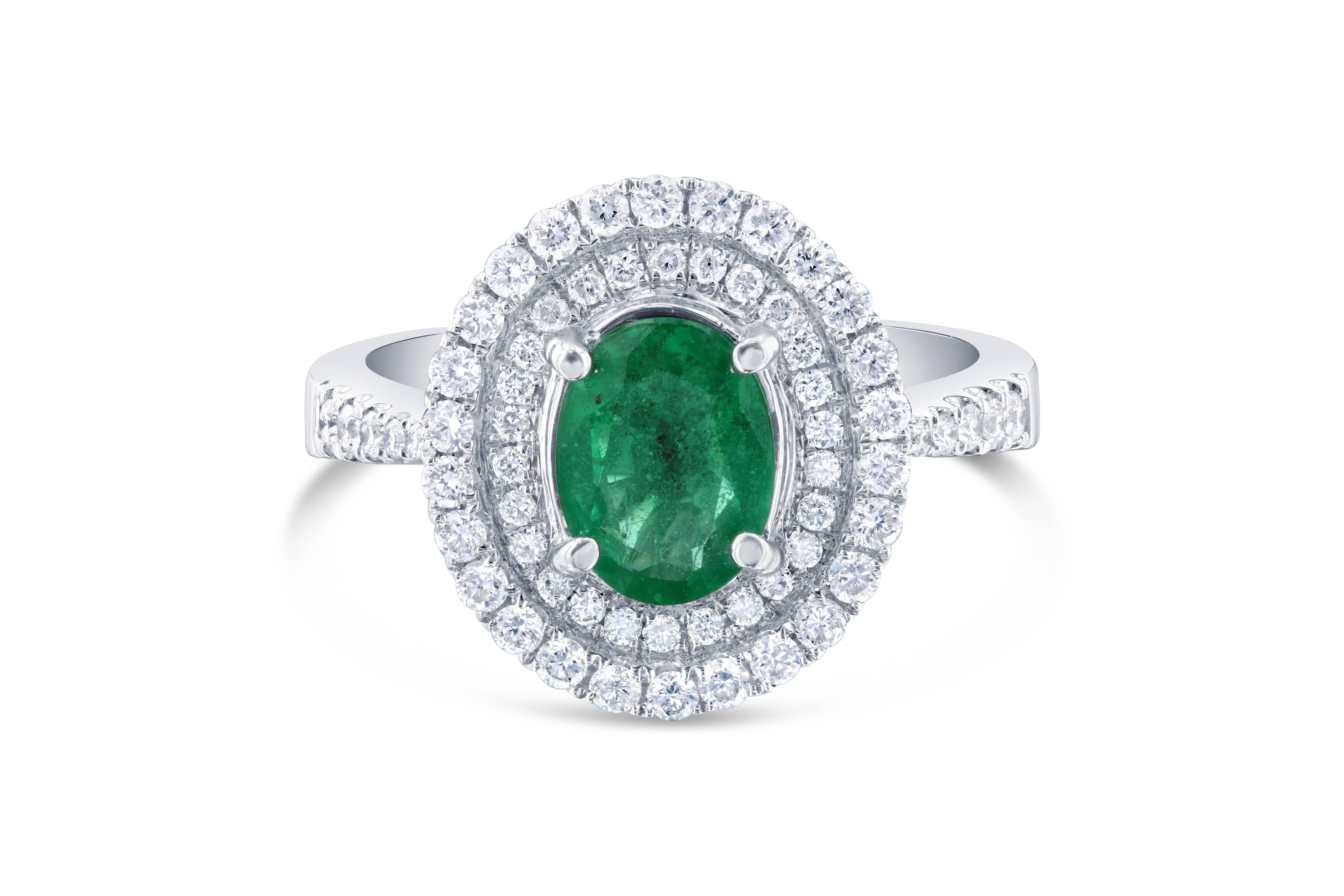  Double Halo Oval Cut Emerald Engagement Ring

This Emerald ring has a gorgeous unique look. The center oval cut Emerald is 1.00 Carat and has a Halo of 62 Round Cut Diamonds weighing 0.58 Carats. The clarity and color of the diamonds are VS-F and