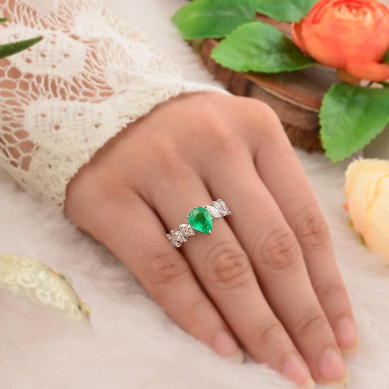 This ring has been meticulously crafted from 14-karat gold.  It is hand set with 1.58 carats emerald & 1.11 carats of sparkling diamonds. 

The ring is a size 7 and may be resized to larger or smaller upon request. 
FOLLOW  MEGHNA JEWELS storefront