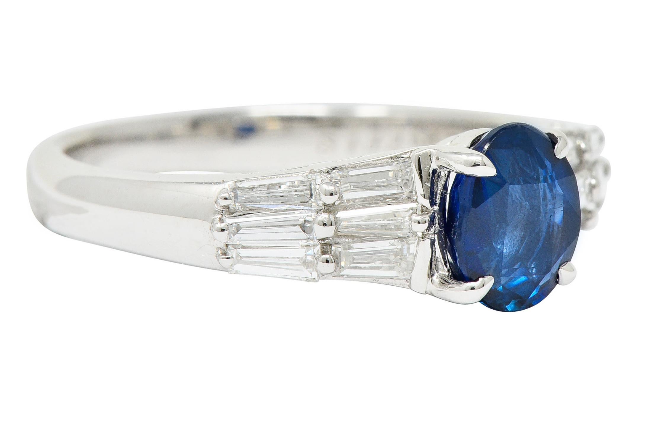 Centering an oval cut Burmese sapphire weighing 1.12 carats

Medium-dark blue in color with no indications of heat

Flanked by shoulders comprised of baguette cut diamonds

Weighing in total approximately 0.46 carat with G/H color and VS