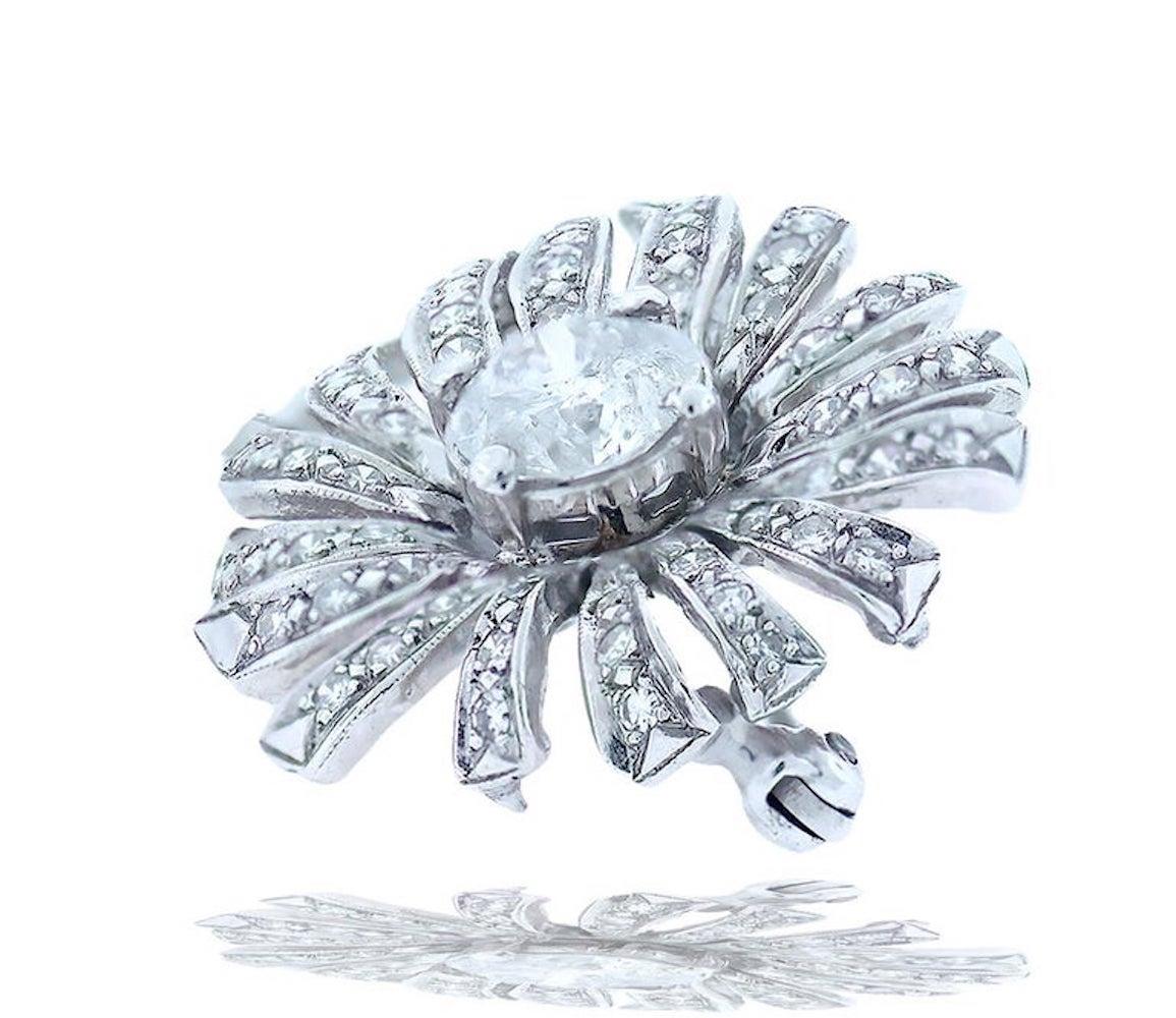 
Solitaire Diamond is featured in a 1940's Antique Pin. 
The pin is  oval shaped  measuring 1.50 x 1 inch and consists of center round brilliant cut diamond.
 The diamond measures 6.63mm.
 Weight is 1.08 ct. total diamond estimated.
 Quality is