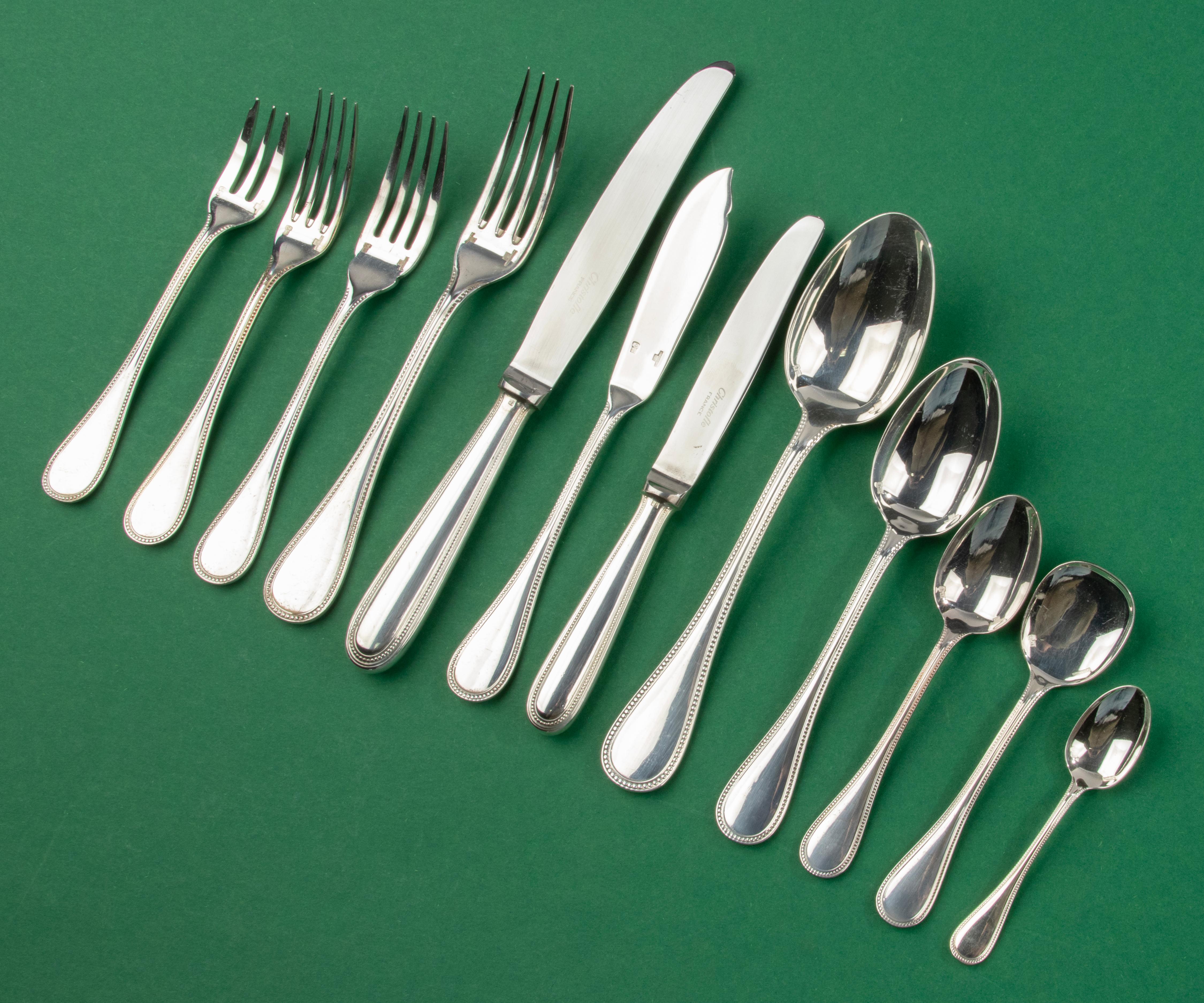 A great set silver plated tableware, complete for 12 persons, made by the French brand Christofle. 
The name of the model is Perles. A classic and timeless design that will fit in any table setting. 
The set is in very good condition, it looks like