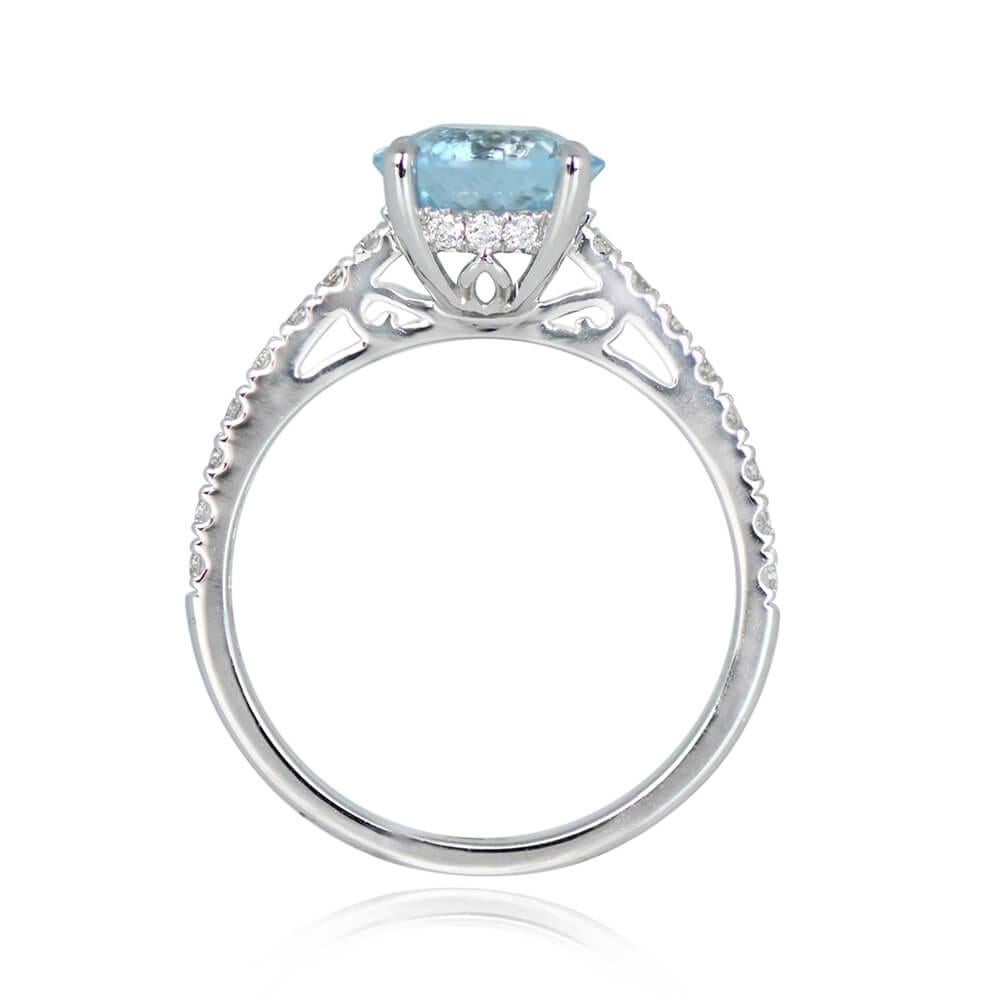 Platinum solitaire ring showcasing a 1.58-carat round aquamarine in prong setting. Shoulders adorned with small round brilliant cut diamonds. Under-gallery features more diamonds and intricate open-work.

Ring Size: 6.5 US, Resizable
Metal: