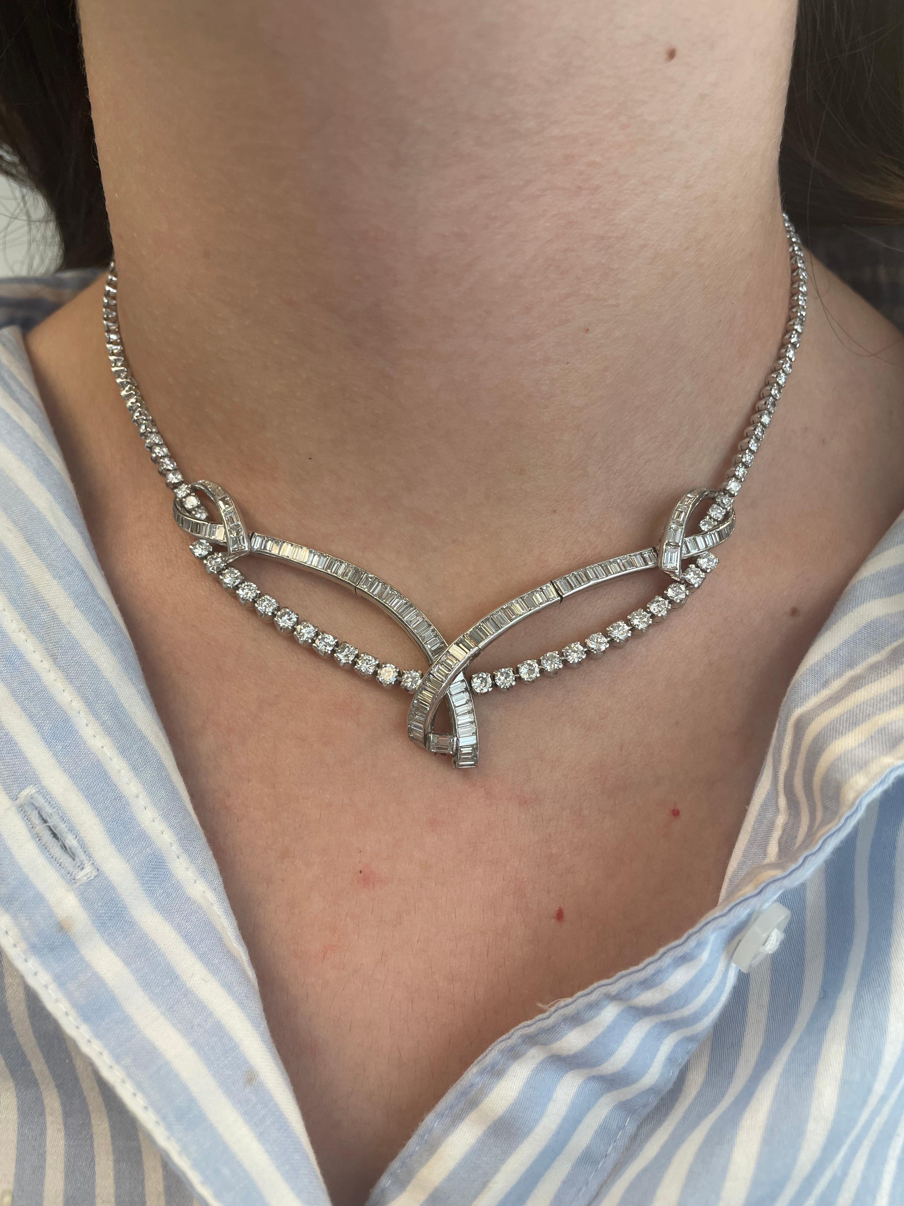 Lovely diamond crossover high jewelry necklace. 
Approximately 15.80 carats of baguette and round brilliant diamonds. Approximately H/I color and VS clarity. Platinum.
Accommodated with an up-to-date appraisal by a GIA G.G. once purchased, upon