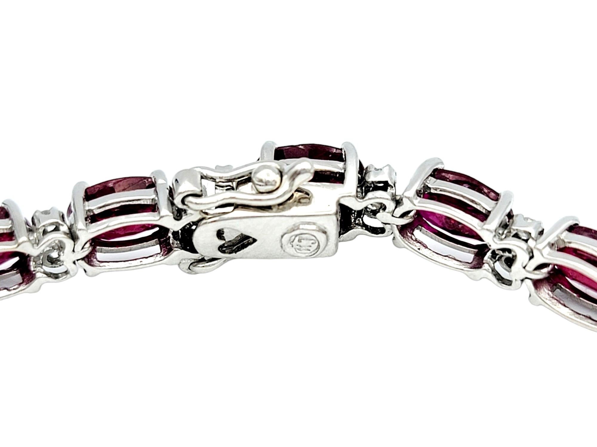 Oval Cut 15.81 Carat Total Oval Ruby and Diamond Tennis Bracelet in 14 Karat White Gold For Sale