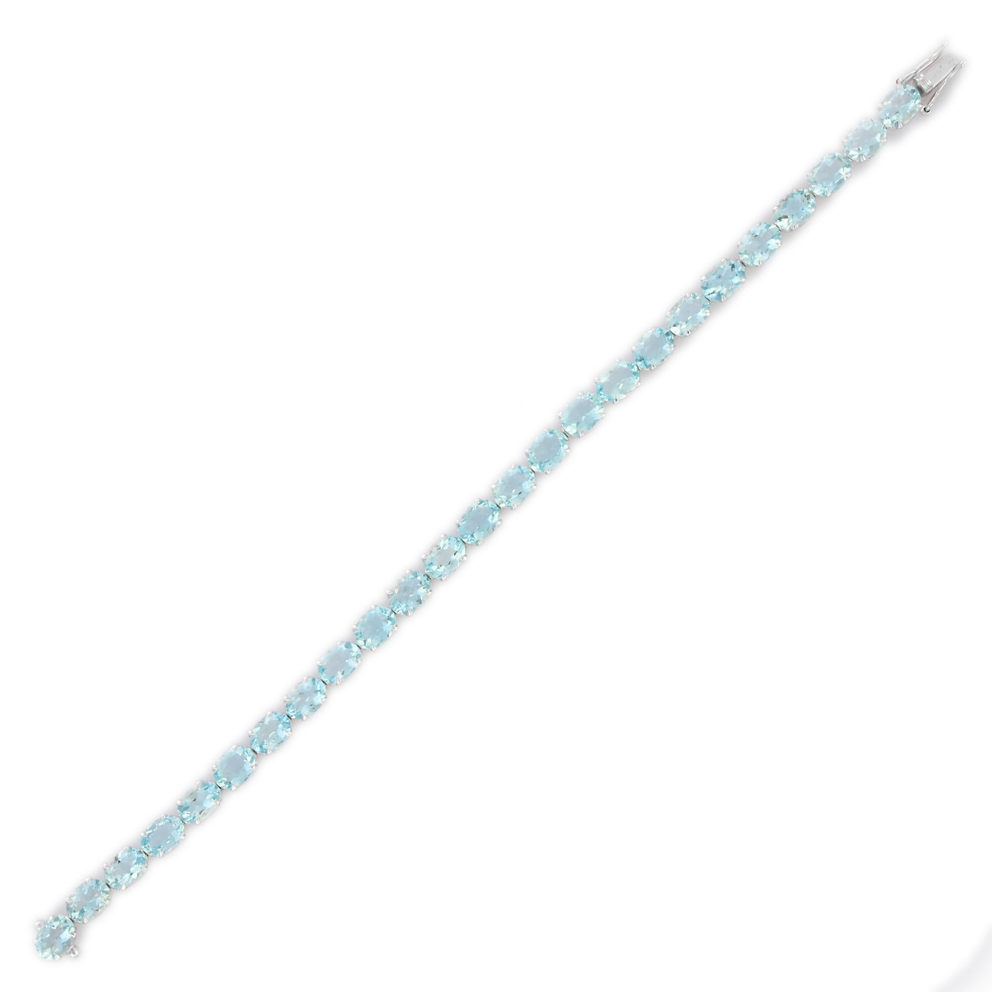 Aquamarine Tennis Bracelet in 18K Gold. It has a perfect oval cut gemstone to make you stand out on any occasion or an event. 
A tennis bracelet is an essential piece of jewelry when it comes to your wedding day. The sleek and elegant style