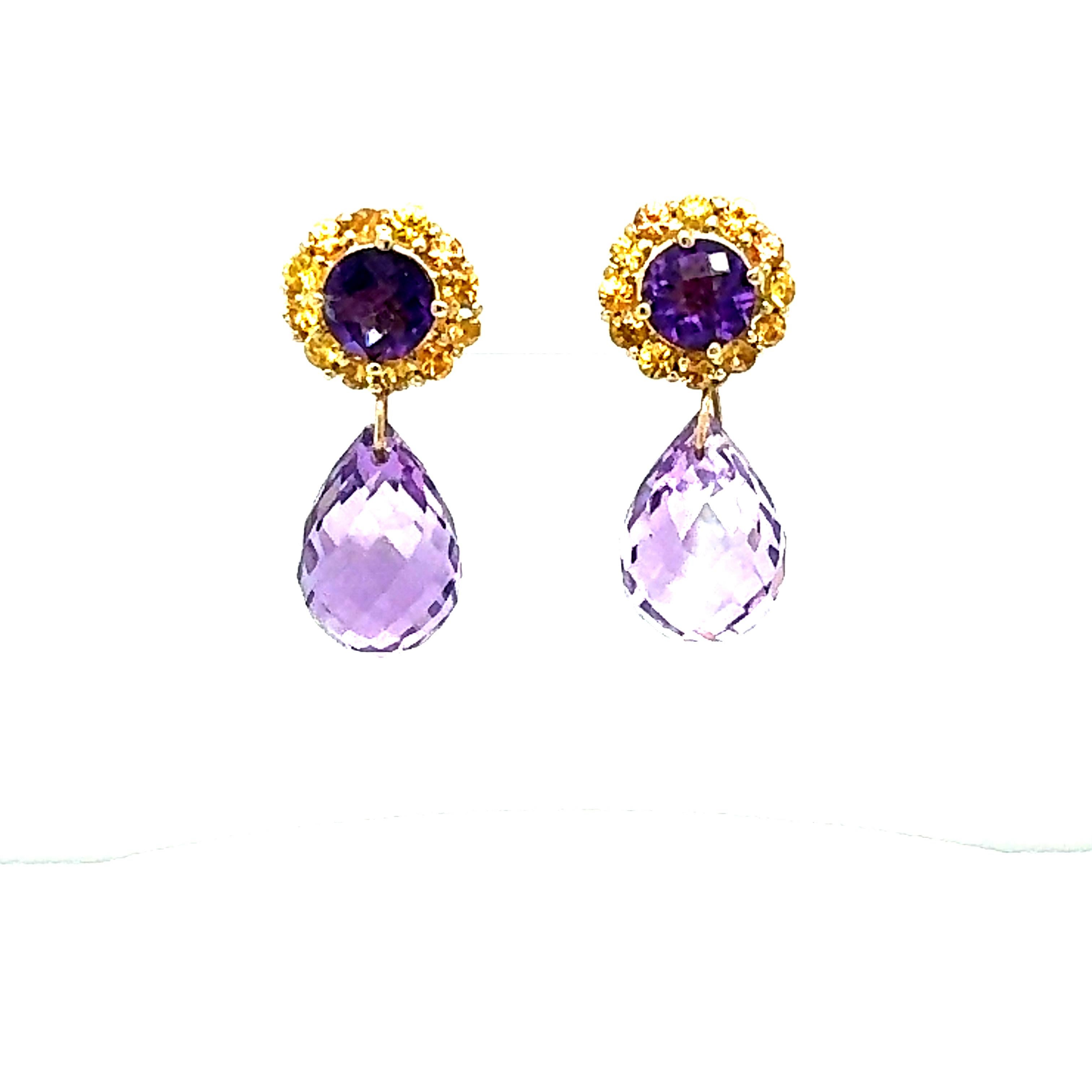 15.85 Carat Amethyst Sapphire Yellow Gold Drop Earrings

Item Specs:

2 Faceted Briolette Amethysts stones weighing approximately 13.34 carats
(Measurements of Amethyst Faceted Briolette 15mm x 12mm) 
2 Round Cut Amethysts weighing 1.48 carats
24