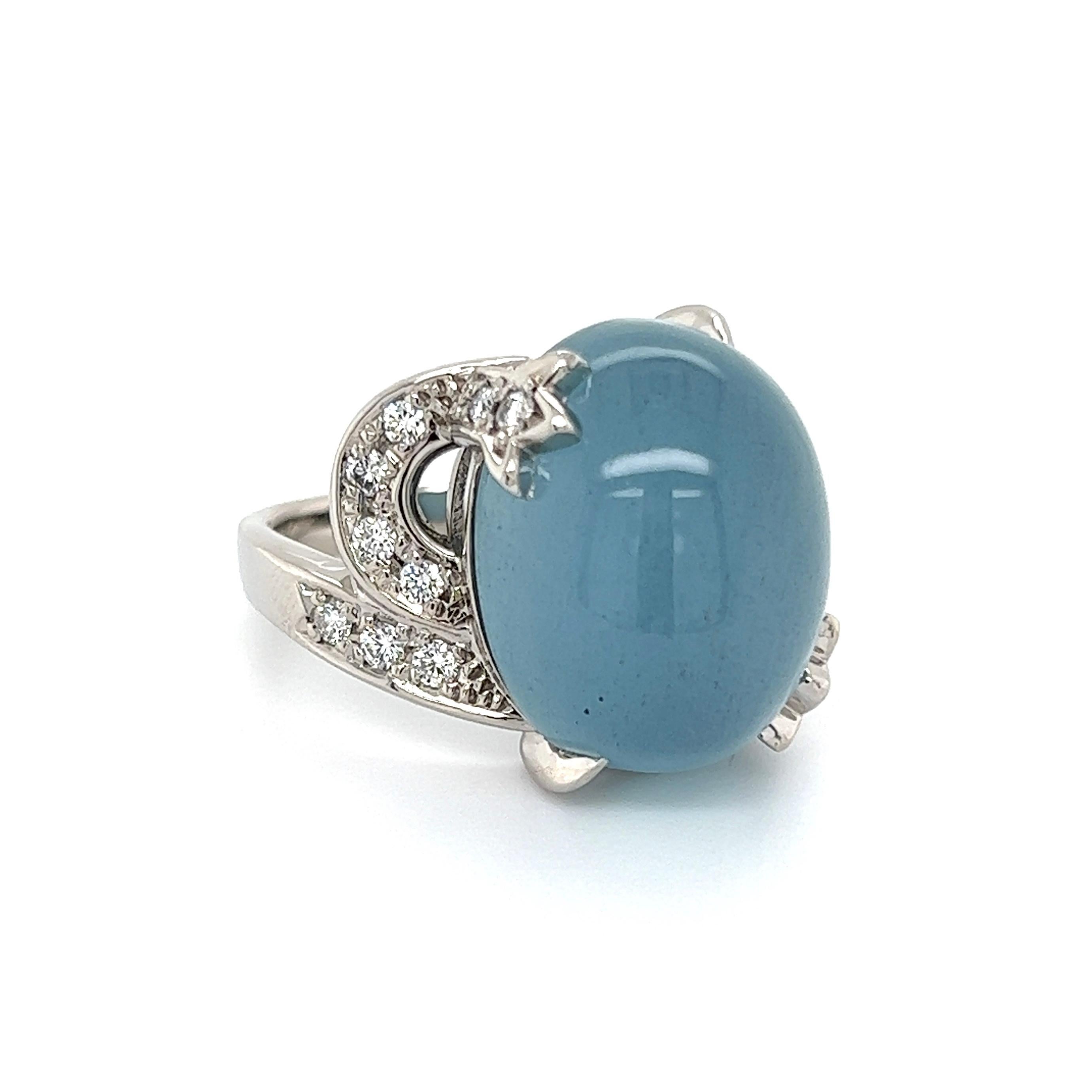 Simply Beautiful! Aquamarine and Diamond Cocktail Ring. Centering a securely nestled Hand set Cabochon Aquamarine enhanced with Diamonds on either side, weighing approx. 0.28tcw. Hand crafted Platinum mounting. Dimensions: 1.19: l x 0.83” w x 0.68”