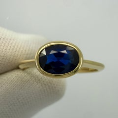 1.58ct Deep Royal Blue Oval Cut Sapphire 18k Yellow Gold Bezel East West Ring