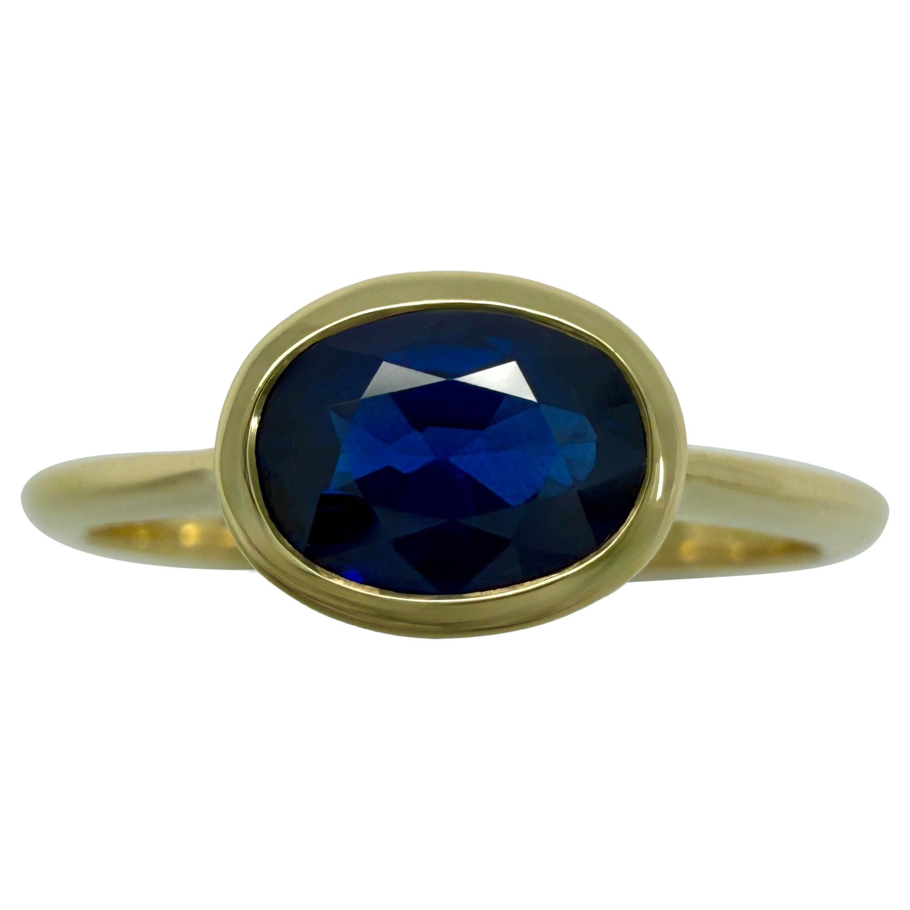1.58ct Deep Royal Blue Oval Cut Sapphire 18k Yellow Gold Bezel East West Ring