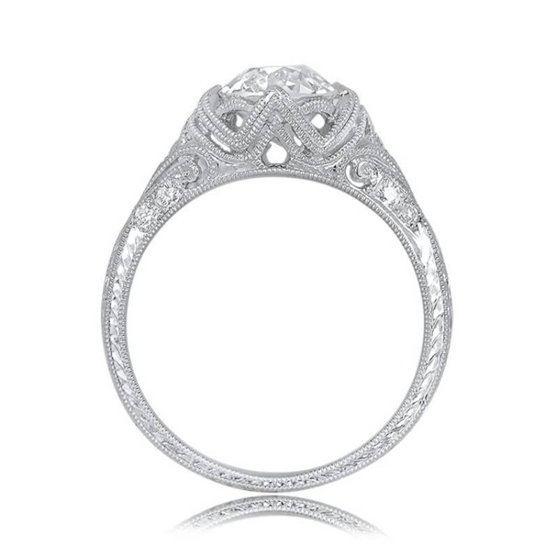 This lovely engagement ring showcases a 1.58-carat old European cut diamond with K color and VS2 clarity. It draws inspiration from Edwardian Era designs and is meticulously handcrafted in platinum by our skilled European jewelers. The ring is