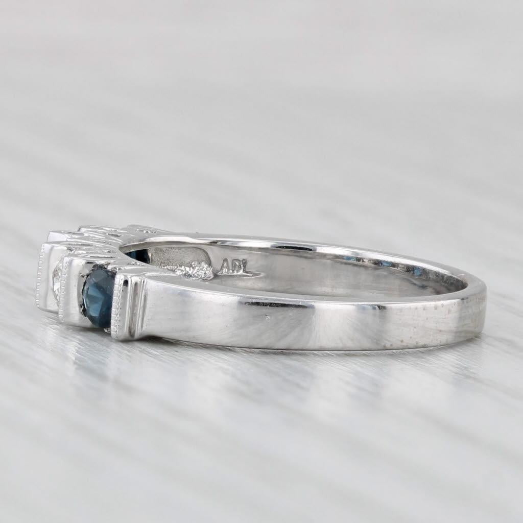 Gemstone Information:
- Natural Sapphires -
Total Carats - 1.44ctw
Cut - Round
Color - Dark Blue
Treatment - Heated

- Natural Diamonds -
Total Carats - 0.14ctw
Cut - Round Brilliant
Color - I - J
Clarity - VS2 - SI1

Metal: 14k White Gold
Weight: