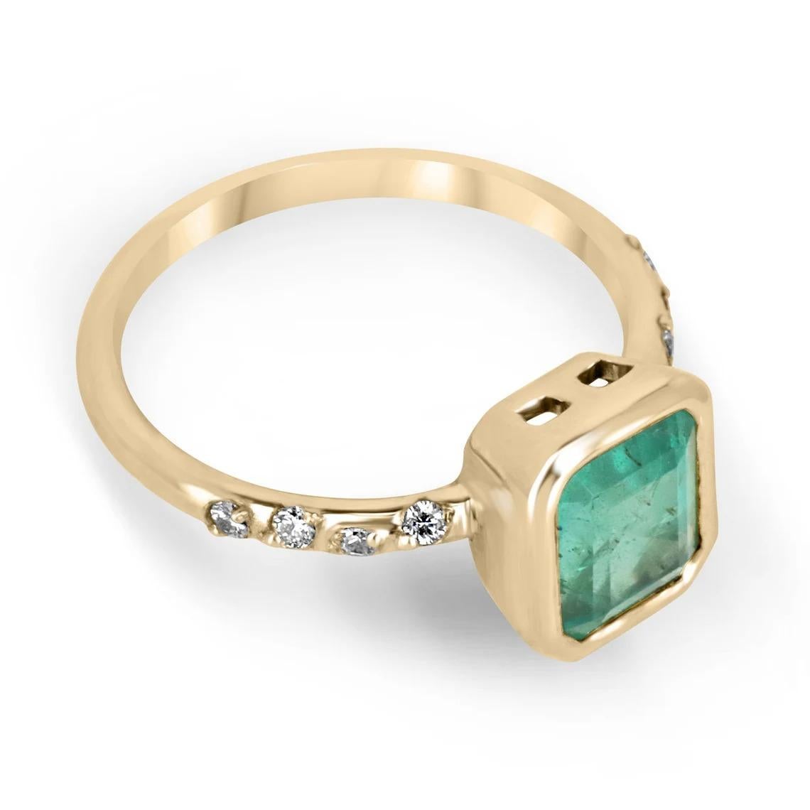This natural Zambian emerald cut emerald ring is a true statement piece. The emerald is set vertically in a bezel setting, which adds a modern twist to the classic style. The emerald cut allows for the stone's natural beauty and color to be fully