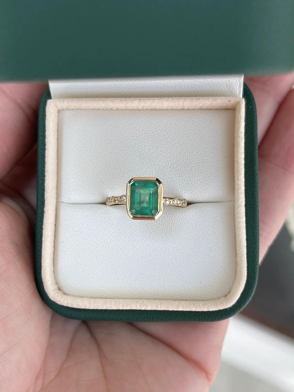 1.58tcw 14K Natural Green Emerald Cut Emerald & Diamond Shank Accent Bezel Ring In New Condition For Sale In Jupiter, FL
