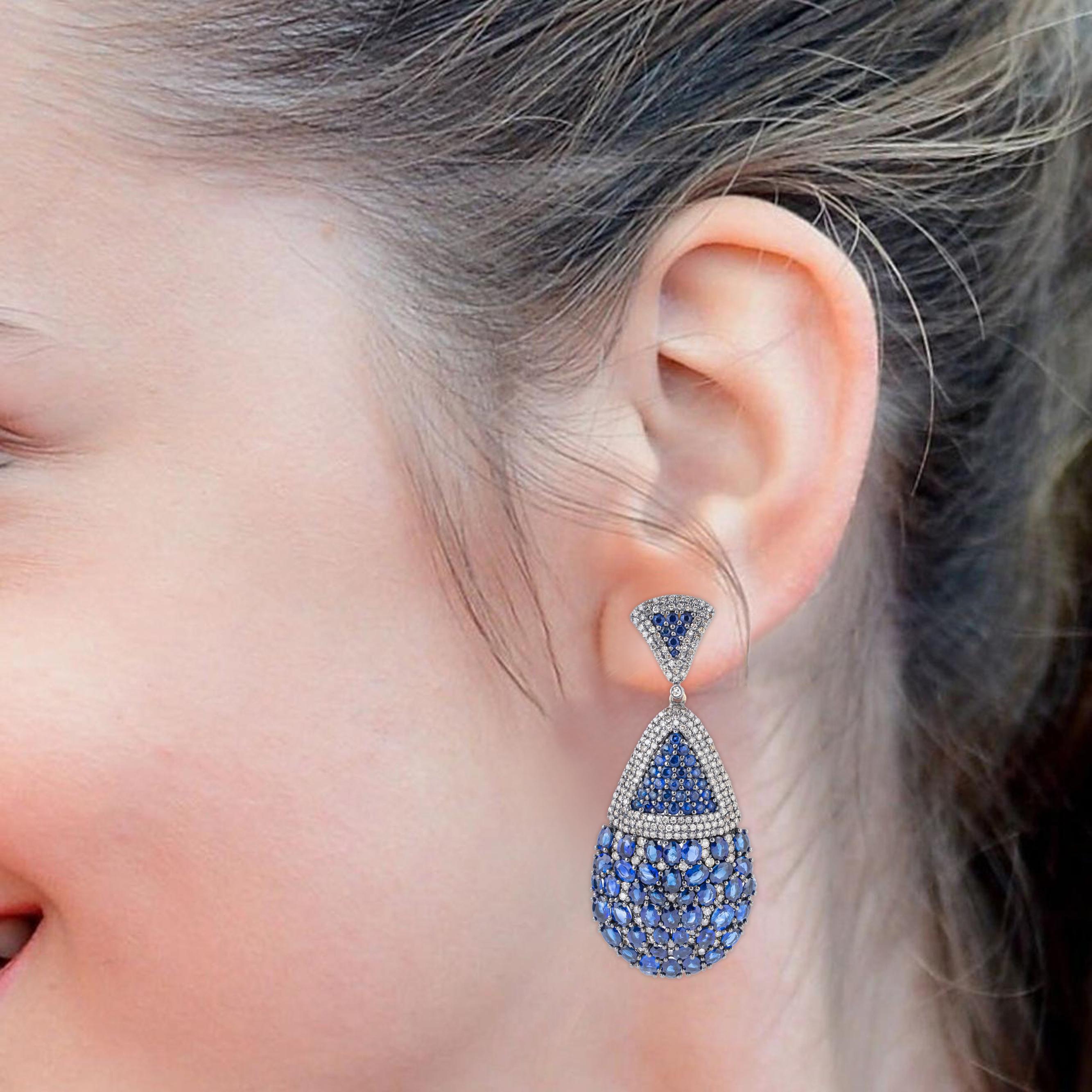 Immerse yourself in the opulence of our 15.9 Carat Diamond and Sapphire Drop Earrings, where impeccable design meets the brilliance of precious gemstones. Each pair is meticulously crafted to exude elegance and sophistication, showcasing a