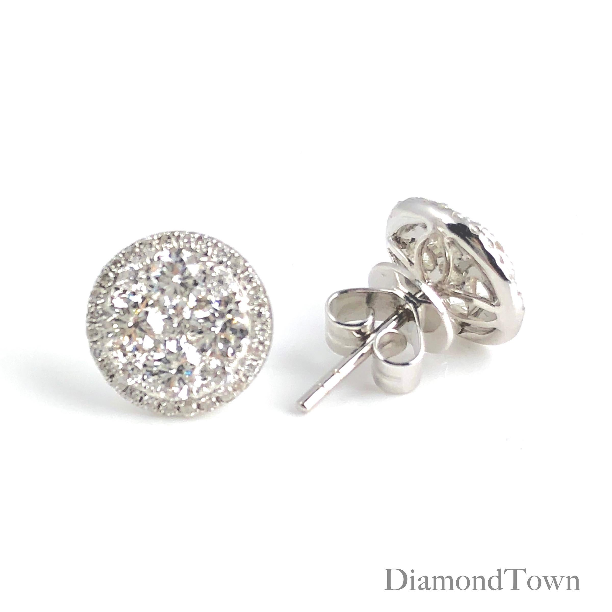 (DiamondTown) These stud earrings feature a cluster of round white diamonds, surrounded by an additional halo of round white diamonds. Set in 18k White Gold.

Many of our items have matching companion pieces. Please inquire.

DiamondTown will