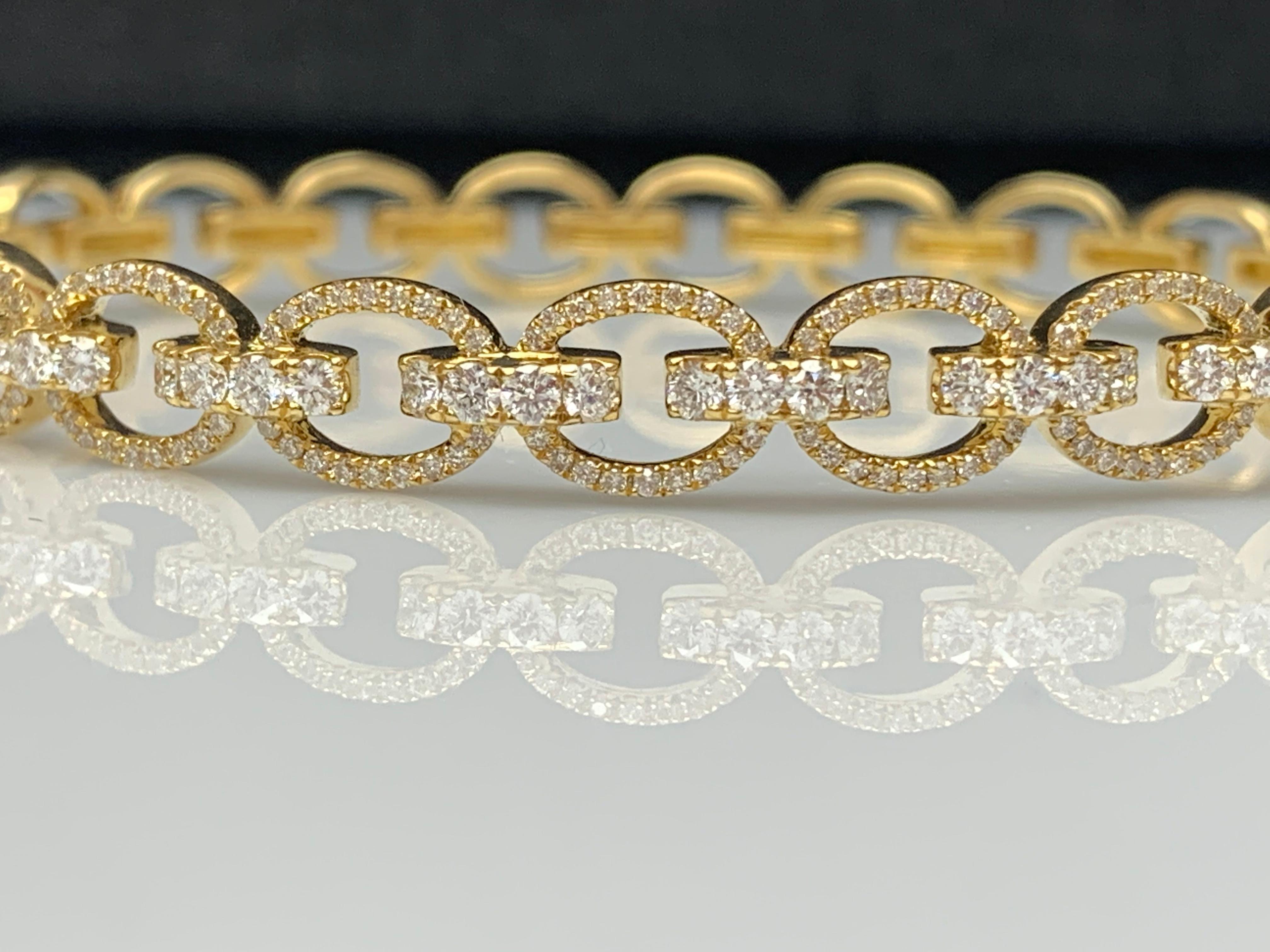 A beautiful and important bangle showcasing 1.59 carats of round brilliant diamonds big and small both, set in an intricately-designed open-work setting made in 18k yellow gold.

Style available in different price ranges. Prices are based on your