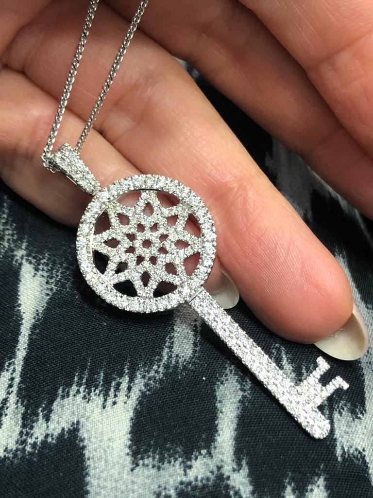 Our one of a kind 1.59 Carat key pendant is set with high quality round cut diamonds and made with exquisite craftsmanship. 
This sparkly 14K white gold key pendant comes with a white gold necklace and will get you compliments where every you go.