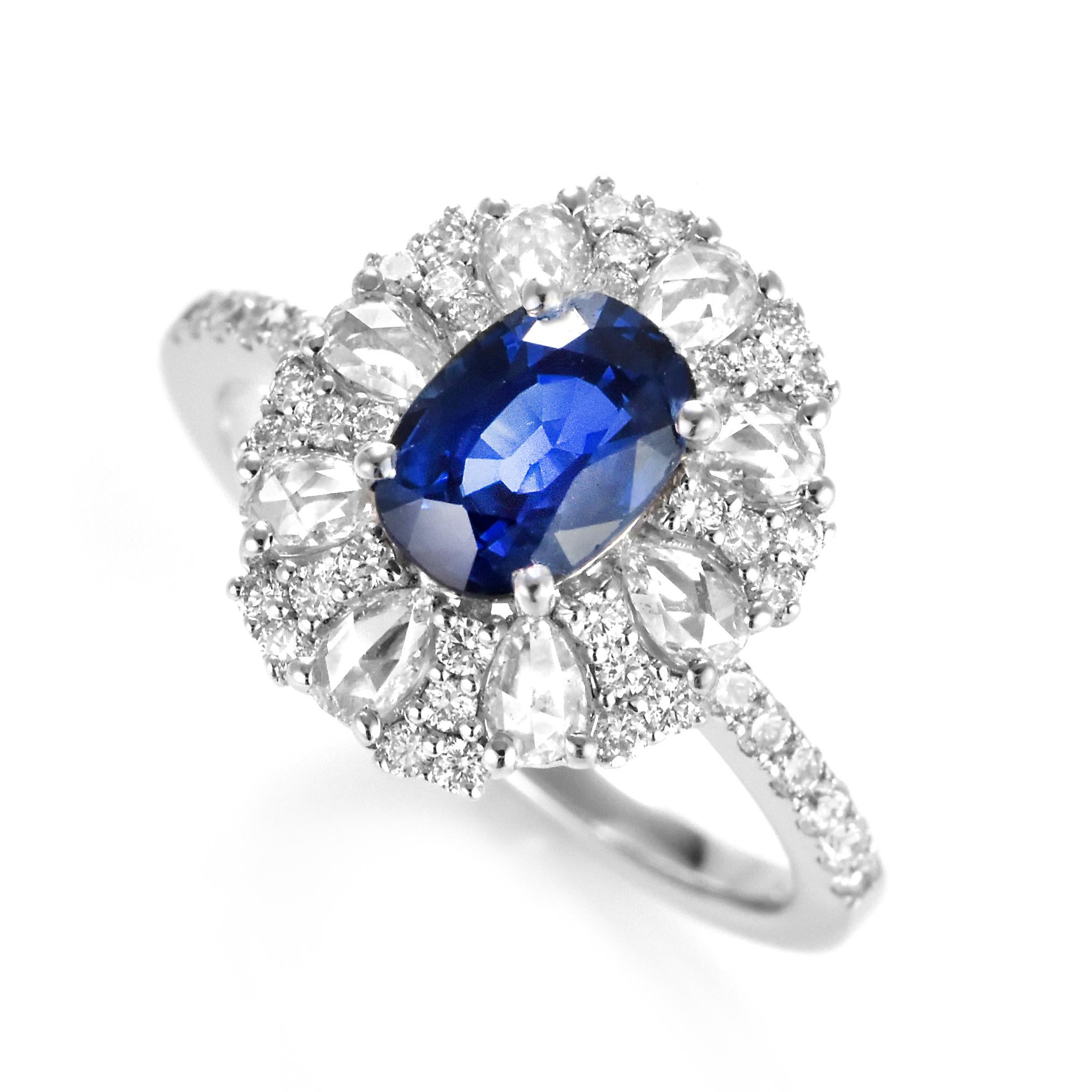 A beautiful ring featuring a 1.59 Carat Natural Sapphire and 0.897 Carats Diamond Accents set in 18 Karat White Gold. Sapphires have extraordinary durability - they excel in hardness as well as toughness and durability making them very popular in
