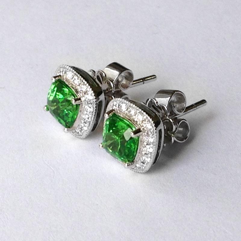 Experience the beauty of spring and nature with these cushion-cut 14K White Gold earrings, adorned with 1.59 carats of Tsavorite and 0.20 carats of Diamonds. The rich and vibrant hues of Tsavorite, shimmering with unmistakable color, make these
