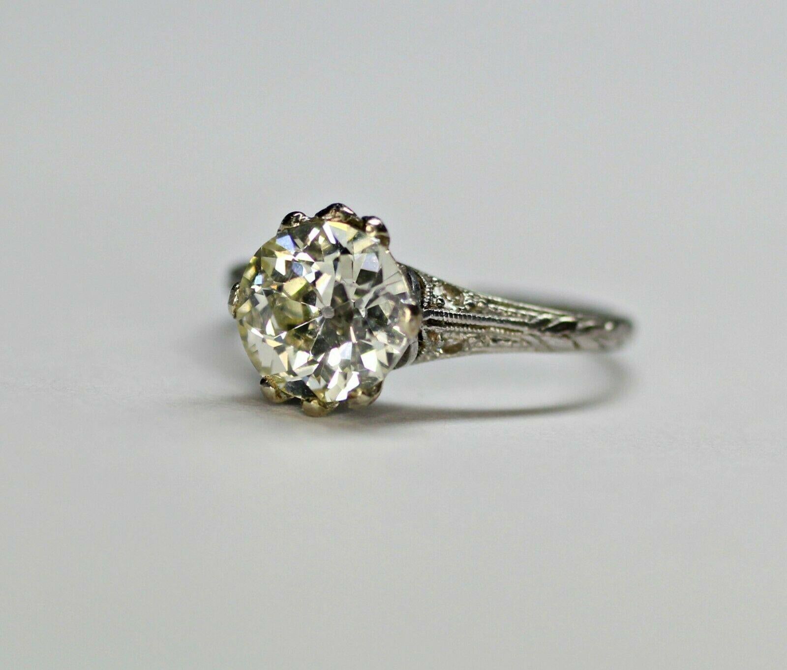  This is an antique platinum ring with a 1.59 carat Old European cut diamond center, K color, VS1 clarity. The ring has an engraving inside its shank, but it can be removed upon request. It has a current ring size of 5US that can be resize for free.