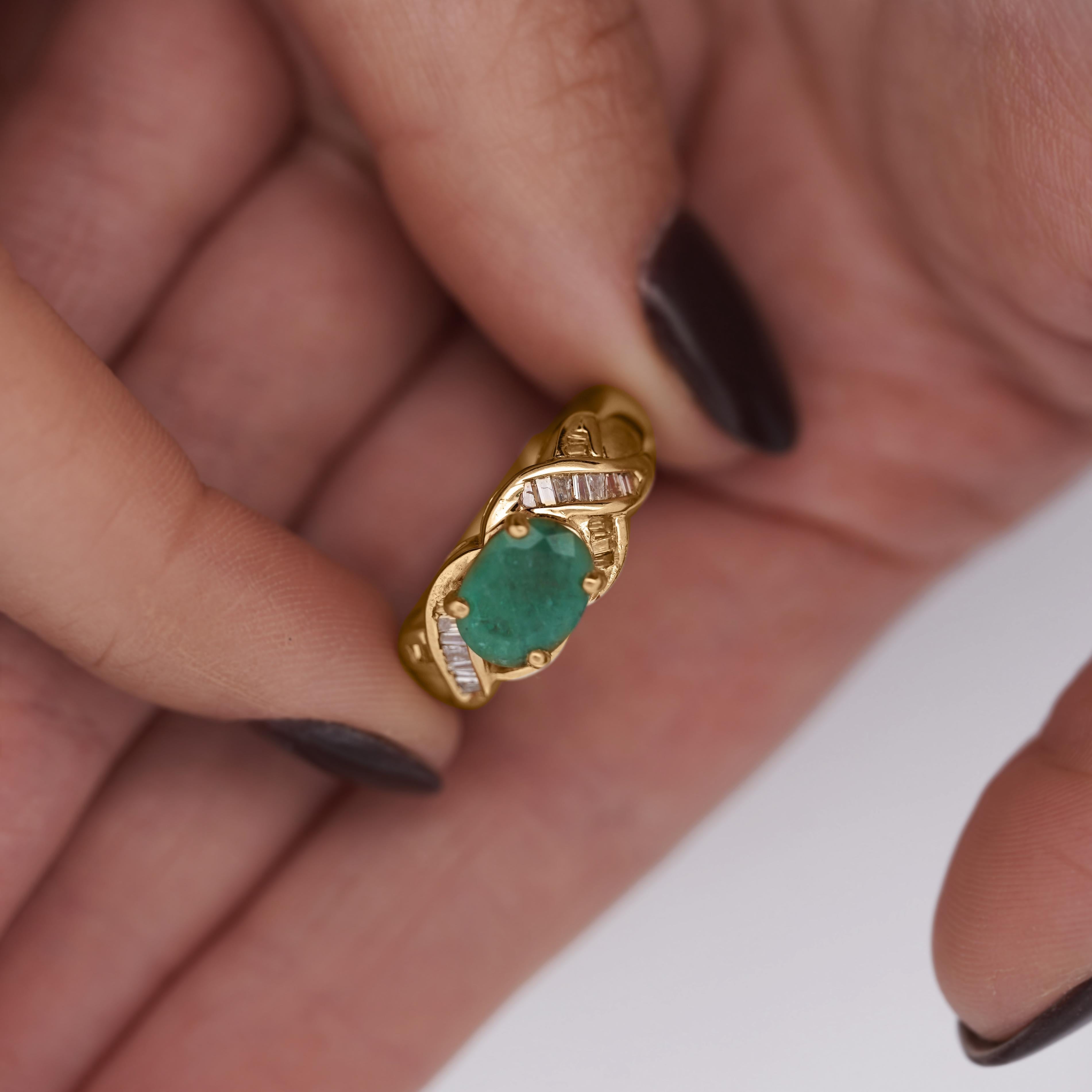 A striking 1.59-carat oval cut. emerald, set in a unique east-west orientation, is framed by sparkling baguette diamonds in this bold yet elegant 14K yellow gold ring.\

Details:
Item Type: Statement Ring
Metal: 14K Yellow Gold
Size: 6 1/4