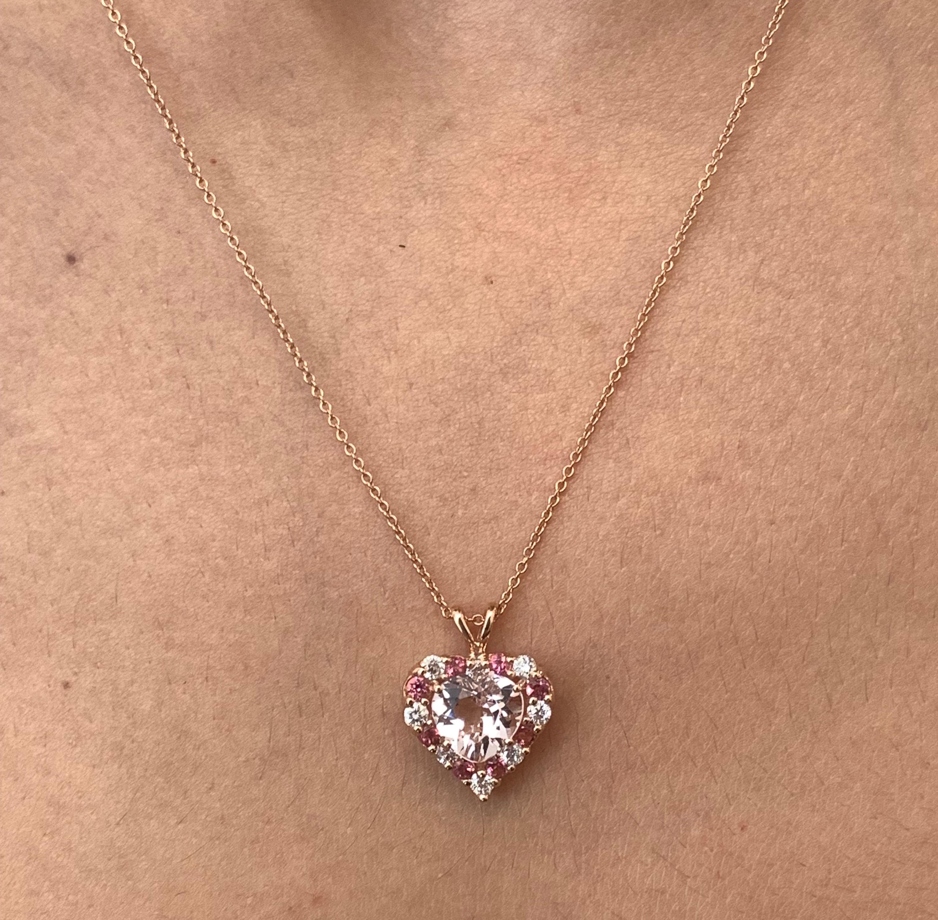Material: 14k Rose Gold 
Center Stone Detail:  1 Heart Shaped Pink Morganite at 1.59 Carats
Stone Details: 8 Round Pink Tourmalines at 0.35 Carats Total
Diamond Details: 8 Brilliant Round White Diamonds at 0.32 Carats - Clarity: SI / Color: