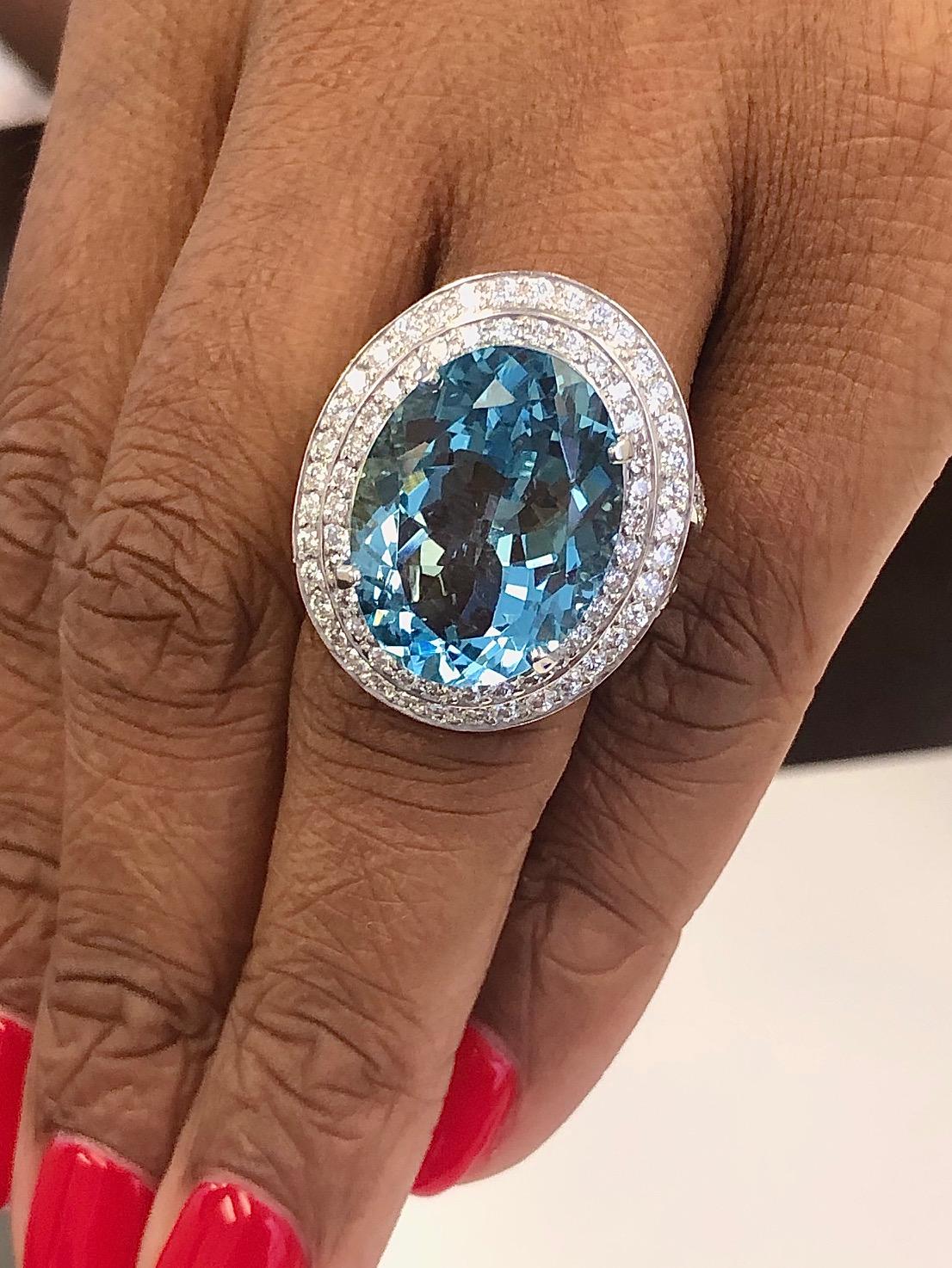 Spectacular ring for this gorgeous color Aqua Marine. The ring is made is 18 Kt White Gold, set with 93 diamonds 1.68 carats and the Oval Aqua Marine 15.95 carats. 
The ring finger size is 6-1/4 ( EU 53)

We manufacture all of our jewelry,  in our