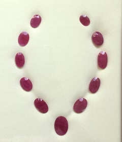 159.61 Carats Ruby Mozambique Oval Faceted Cut stone Layout Heated Natural Gem