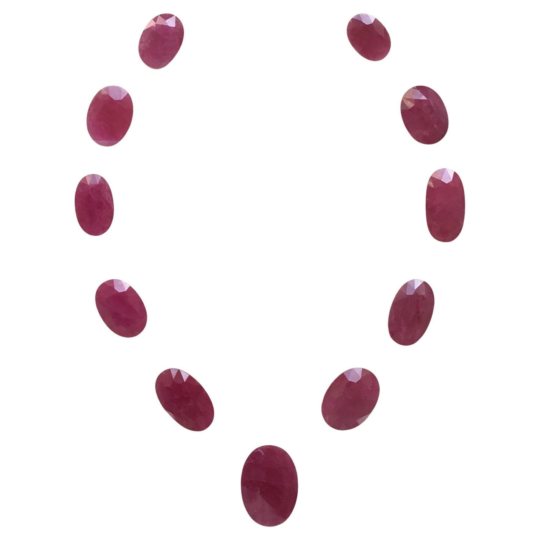 159.61 Carats Ruby Mozambique Oval Faceted Cut stone Layout Heated Natural Gem