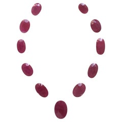 159.61 Carats Ruby Mozambique Oval Faceted Cut stone Layout Heated Natural Gem