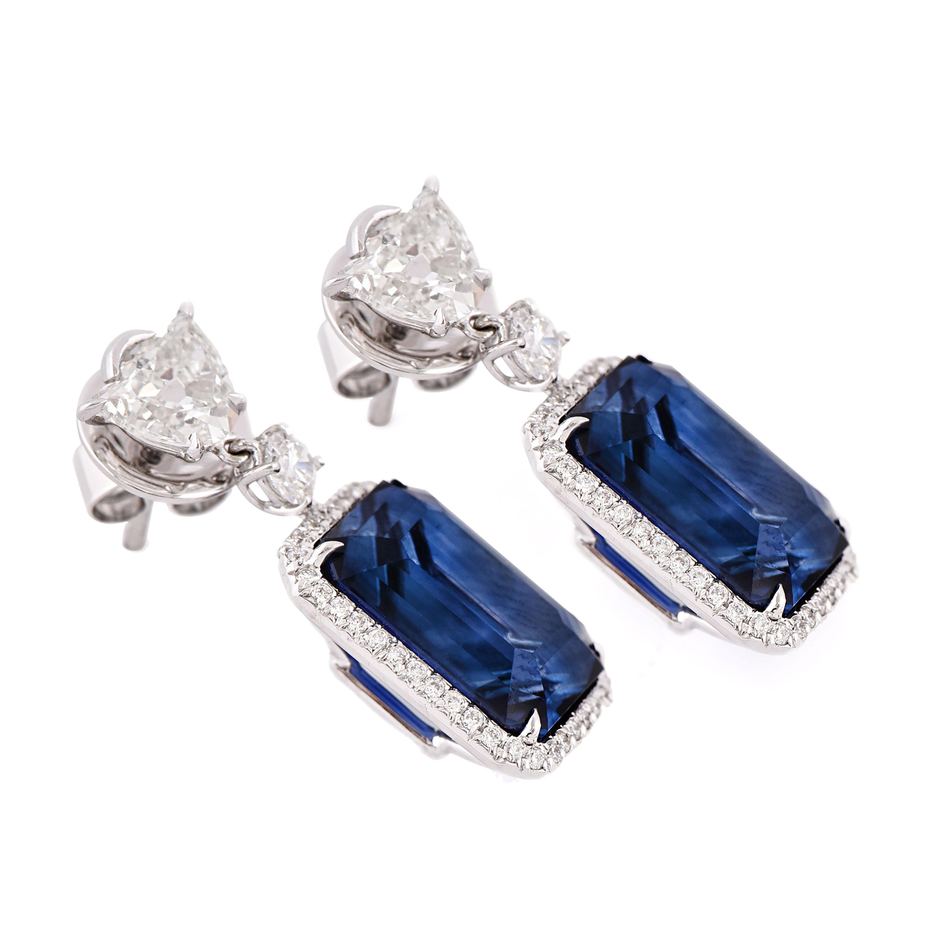 A pair of 18 karat white gold blue sapphire dangle earrings from the Azure collection of Laviere. The earrings are set with two GRS certified vivid blue Madagascar blue sapphires weighing a total of 15.97 carats, 1.40 carats tulip shape diamonds and