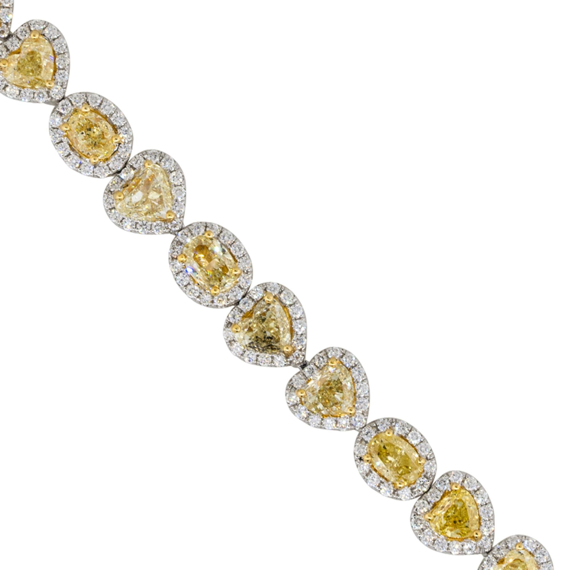 Material: 18k White Gold
Diamond Details: Approx. 3.14ctw of round cut Diamonds. Diamonds are G/H in color and VS in clarity
                             Approx. 12.83ctw of multi shaped Diamonds. Diamonds are Fancy Yellow in color and VS in