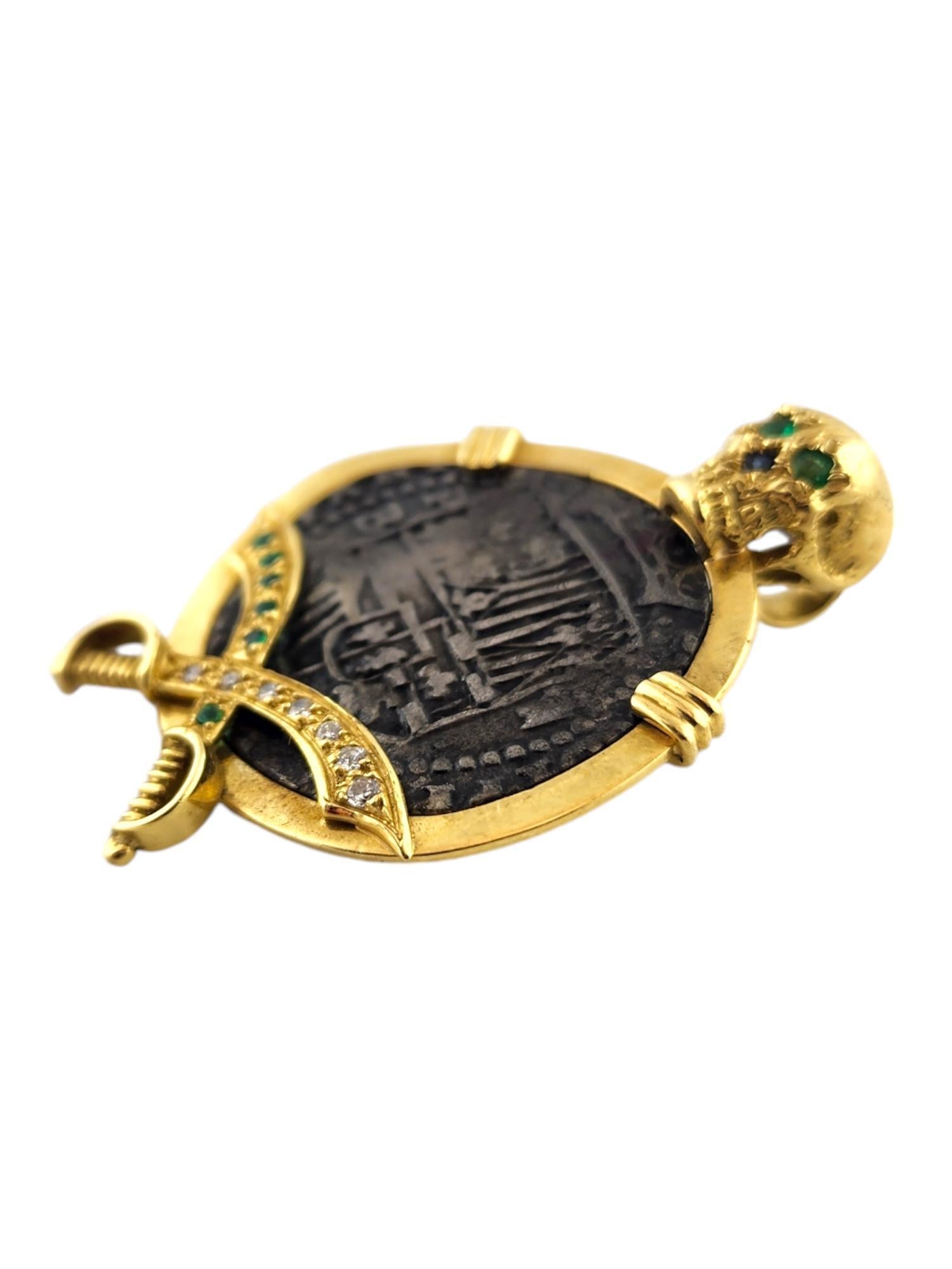 1598-1621 Potosi Min Peru 2 Reales in 18 Karat Yellow Gold Pendant 

This piece features a real Potosi mint 2 Reales coin from Peru in an 18K yellow gold skeleton pendant decorated with 8 emeralds, 7 sparkling diamonds, and 1 sapphire!

Emeralds:
