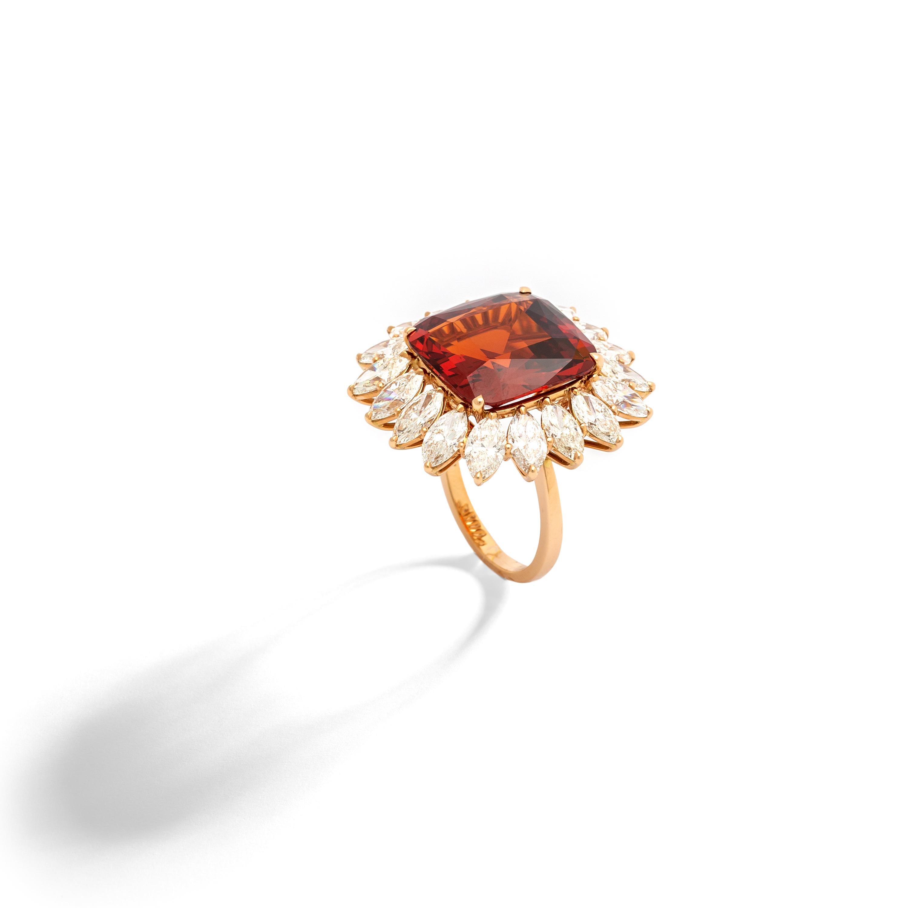 15.98 carats Cushion Garnet spesartite surrounded by 18 Diamonds 5.58 carats on pink gold Ring.
Contemporary.