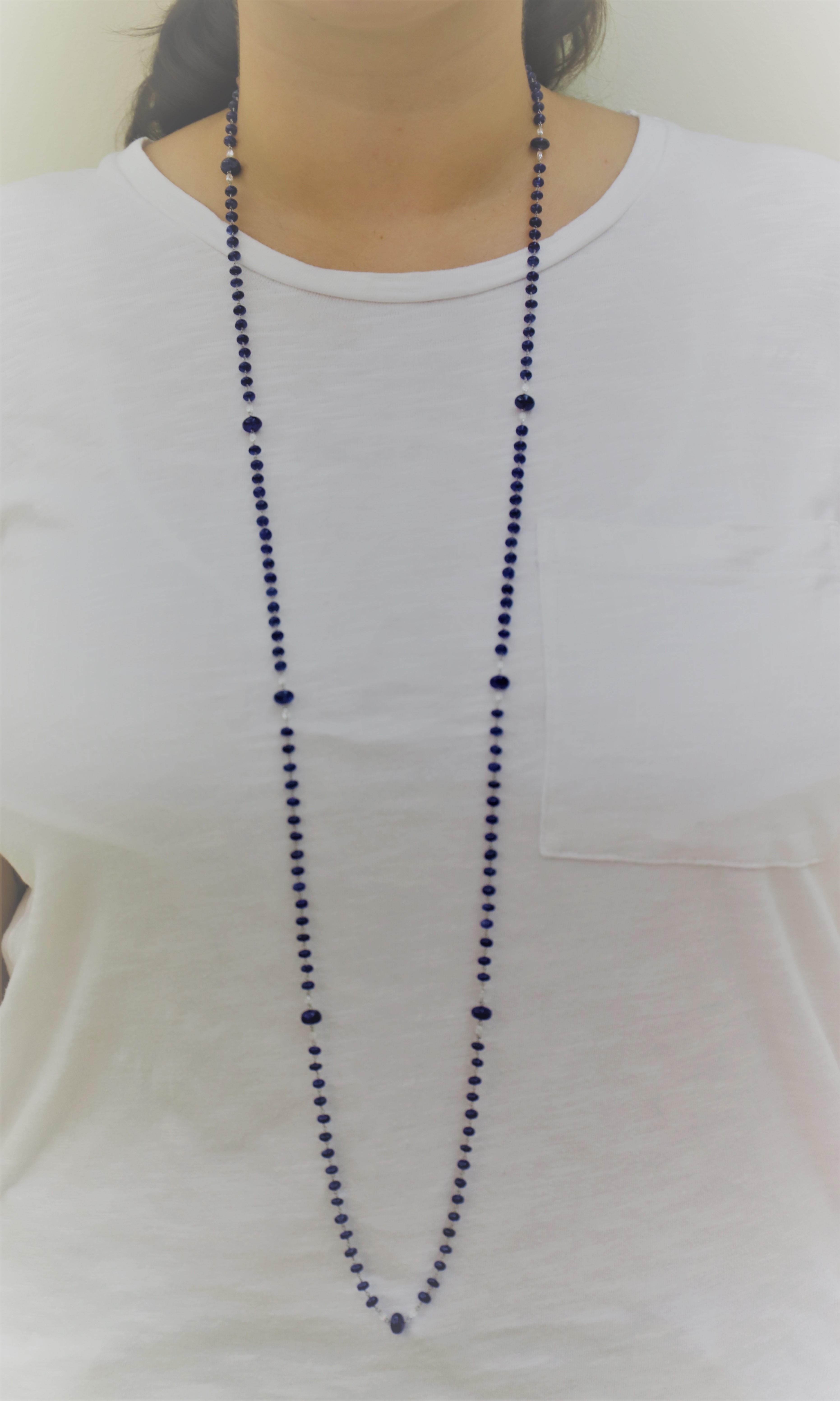 48 inches Long Blue Sapphire Beaded Necklace composed of Blue Sapphire Beads, for 159.97 Carat total, spaced out by White Diamond Briolette, for  4.16 Carat total.

The length of this Sapphire Beaded Necklace allows it to be worn in many different