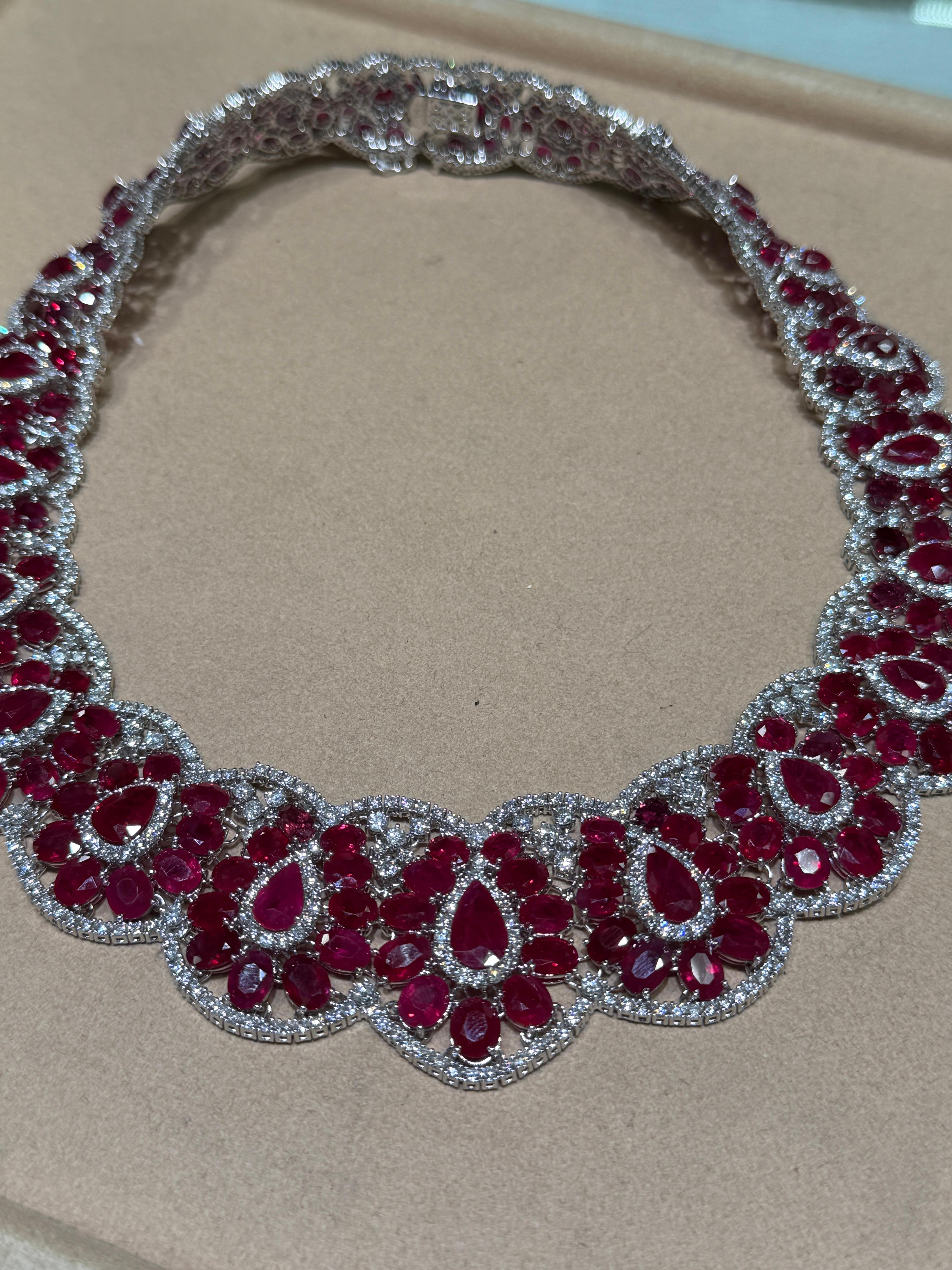 A breathtaking statement of power, romance, and refinement, this handcrafted ruby and diamond high jewelry necklace is the pinnacle of artistry and glamour. Created in solid 18K white gold, this couture-level masterpiece features 196 pieces total,