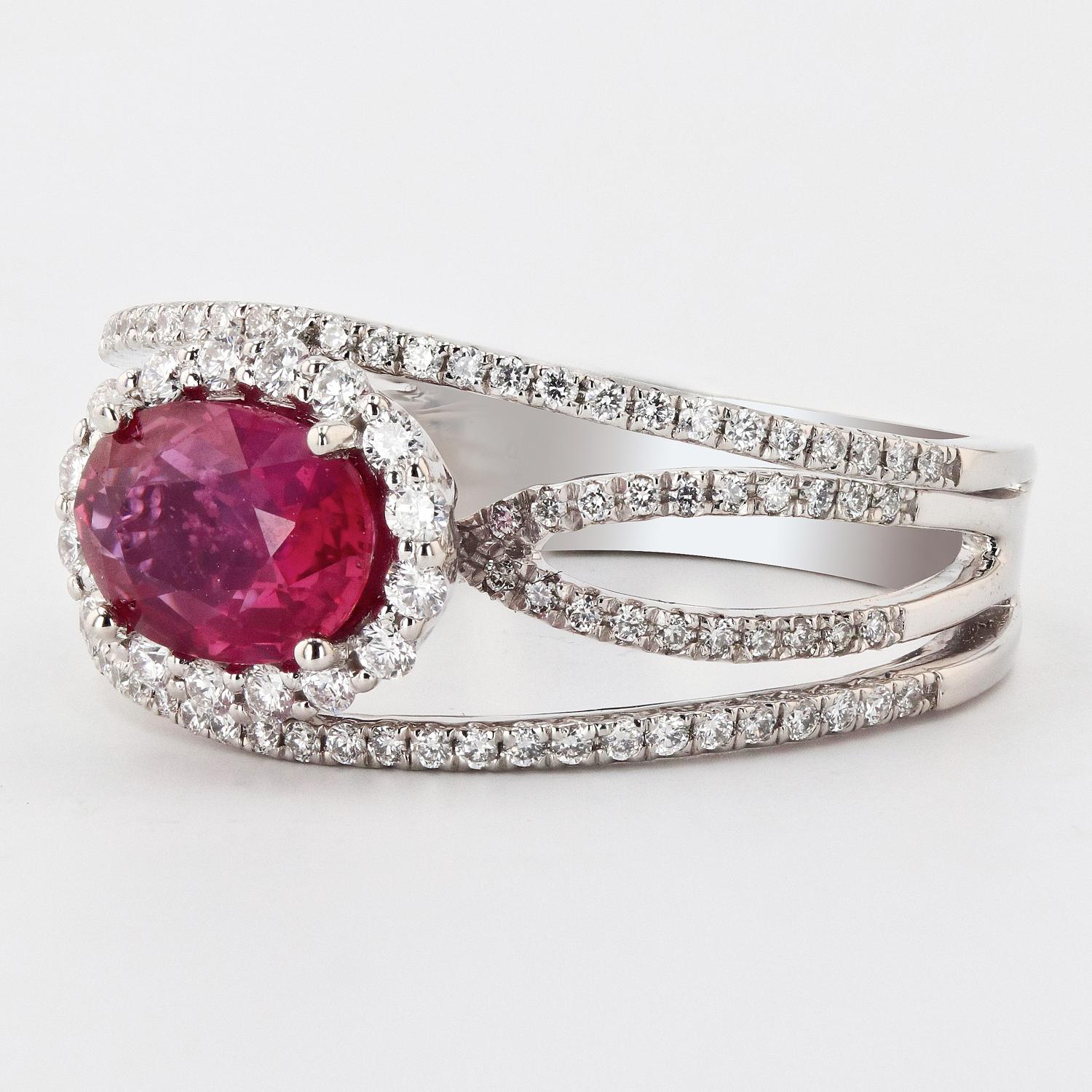 One electronically tested platinum ladies cast & assembled purplish pink sapphire & diamond ring. Condition is new, good workmanship. 

The featured sapphire is set within a diamond bezel, supported by a ribbed under gallery and diamond ribbons,