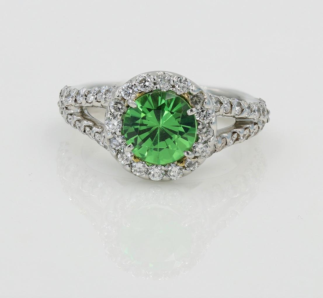 Faceted Round Cut Tsavorite Garnet (Kenya origin) and Diamond Ring - Weighing 1.59cts set in platinum ring mounting with 48 Ideal Cut Diamonds that come out to 1.03cts. total. Ring is a size 5 (can be adjusted). This ring is a Lester Lampert